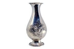 Relief silver vase in Art Nouveau style, resting on an oval base