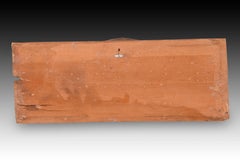 Relief with angel head. Polychrome and gilded wood. Spanish school, 16th century