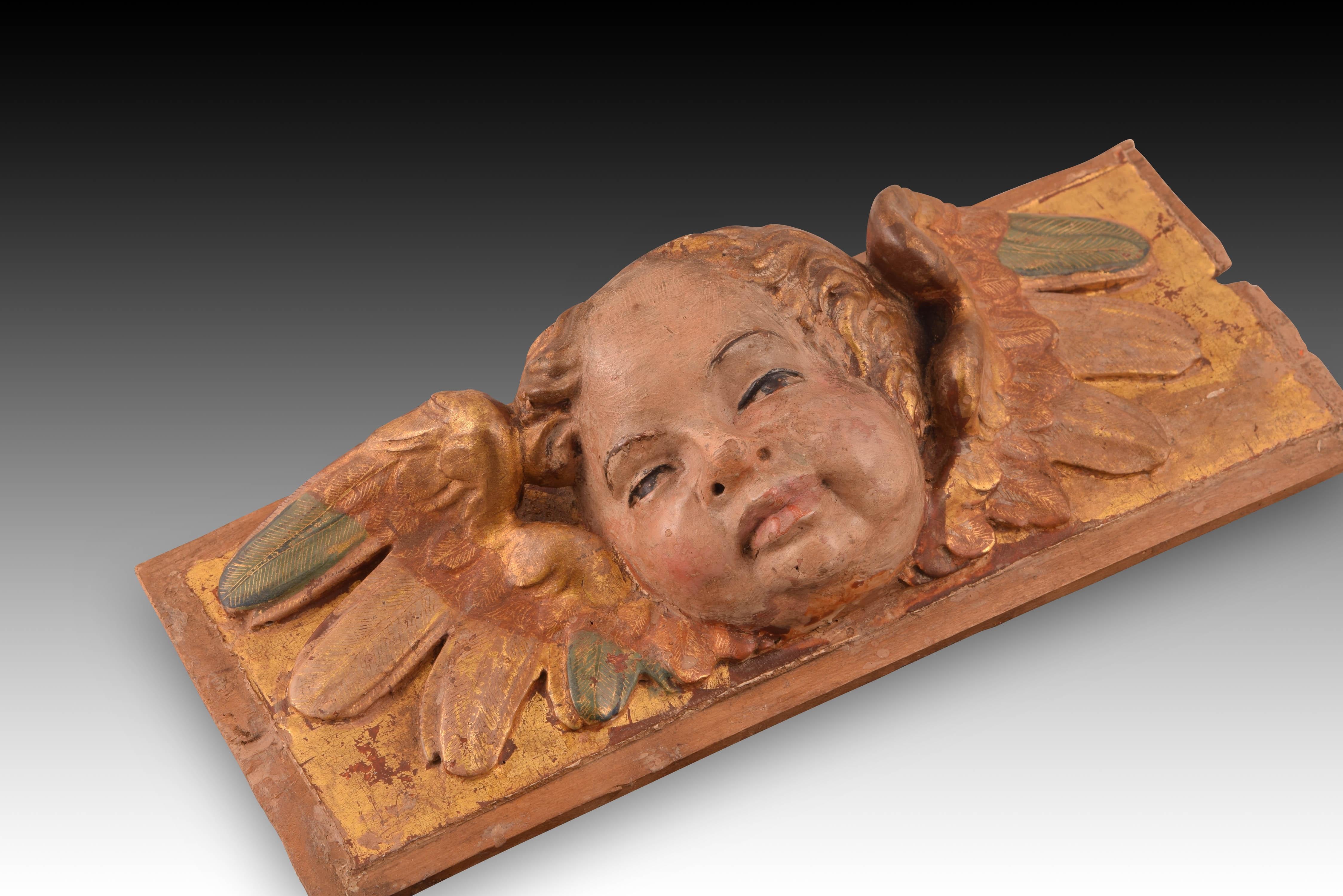 Renaissance Relief avec tête d'ange. Wood Wood polychrome et doré. École espagnole, 16e siècle en vente