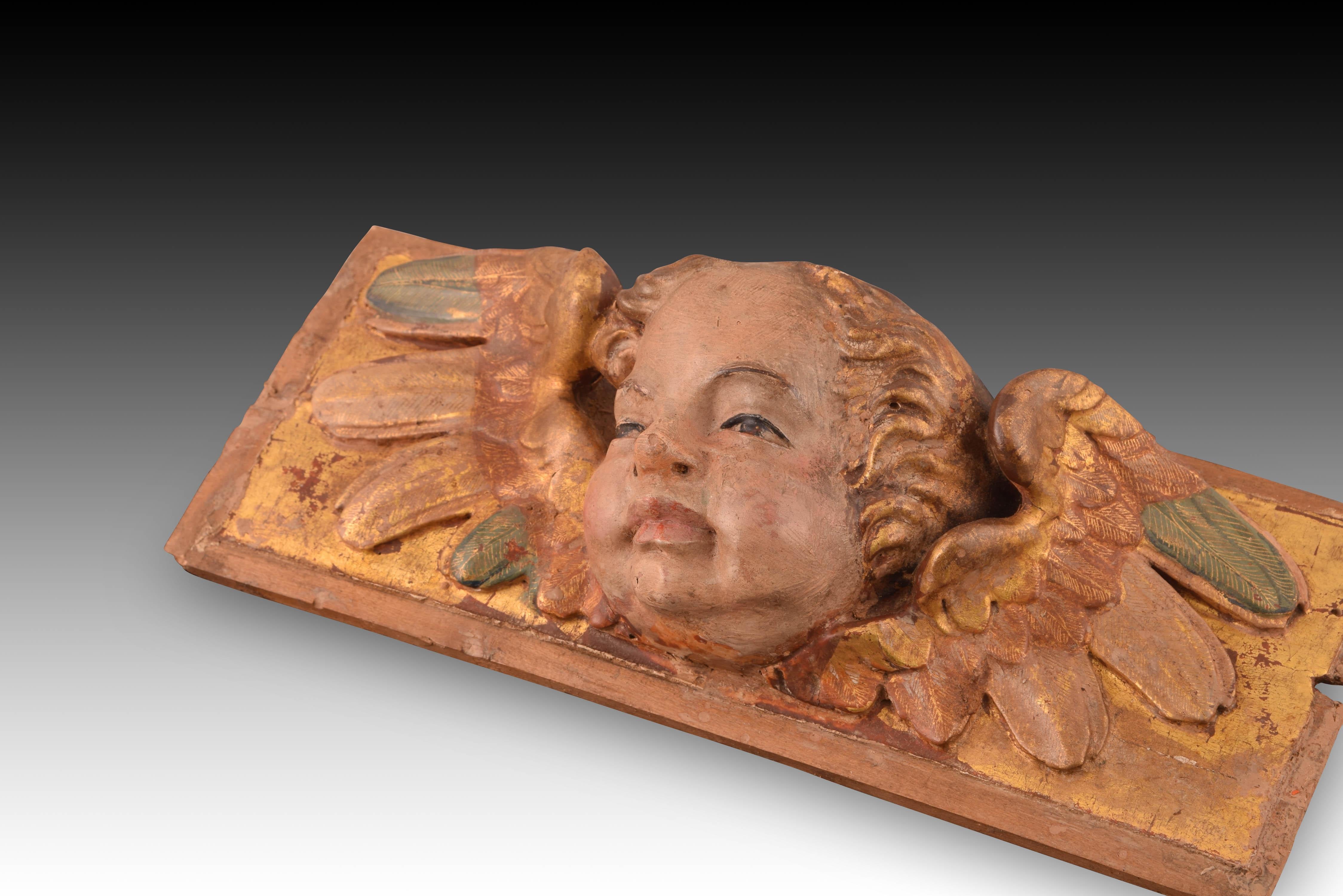 Espagnol Relief avec tête d'ange. Wood Wood polychrome et doré. École espagnole, 16e siècle en vente