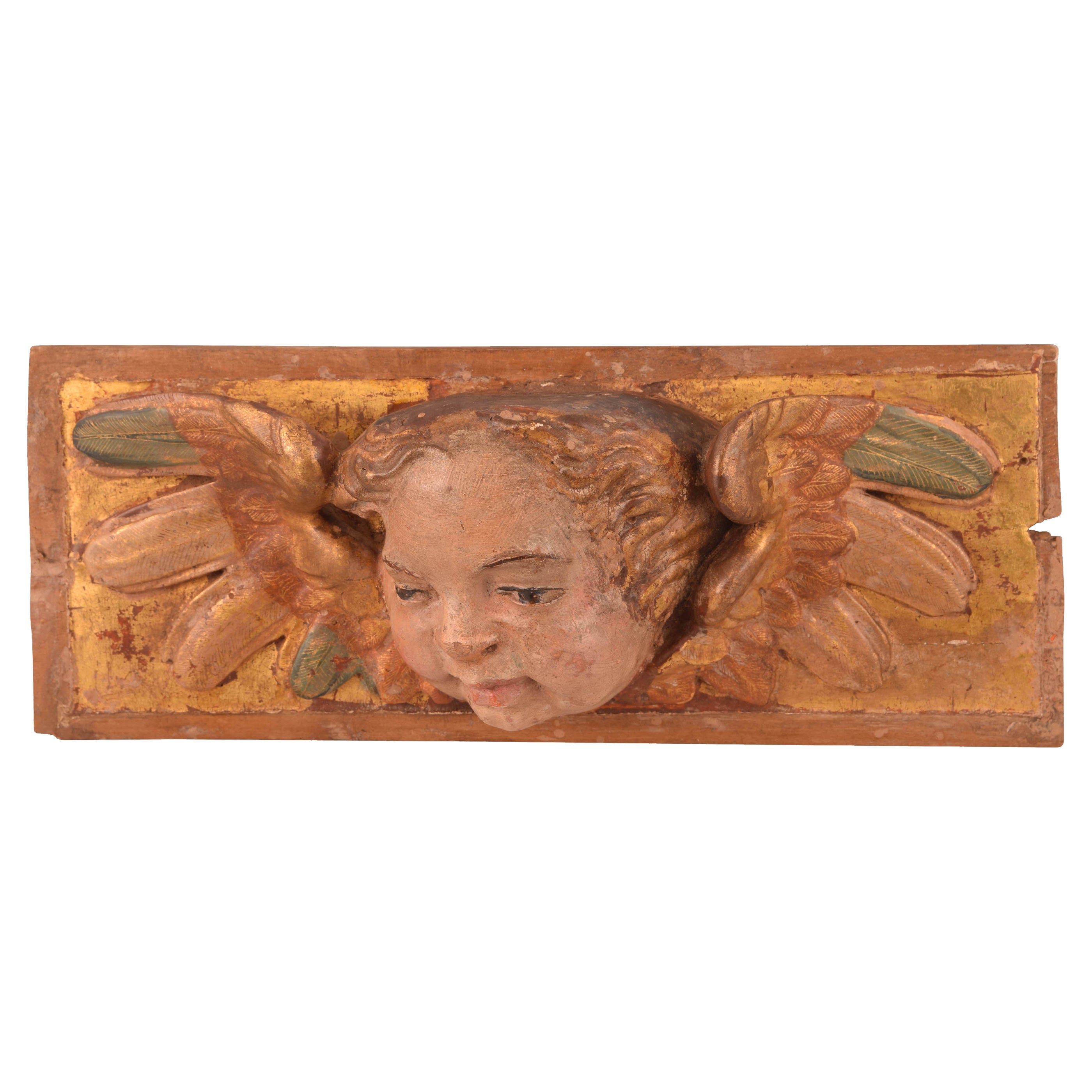 Relief with angel head. Polychrome and gilded wood. Spanish school, 16th century