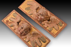 Reliefs with heads of angels. Polychrome and gilded wood. Spanish school, 16th c