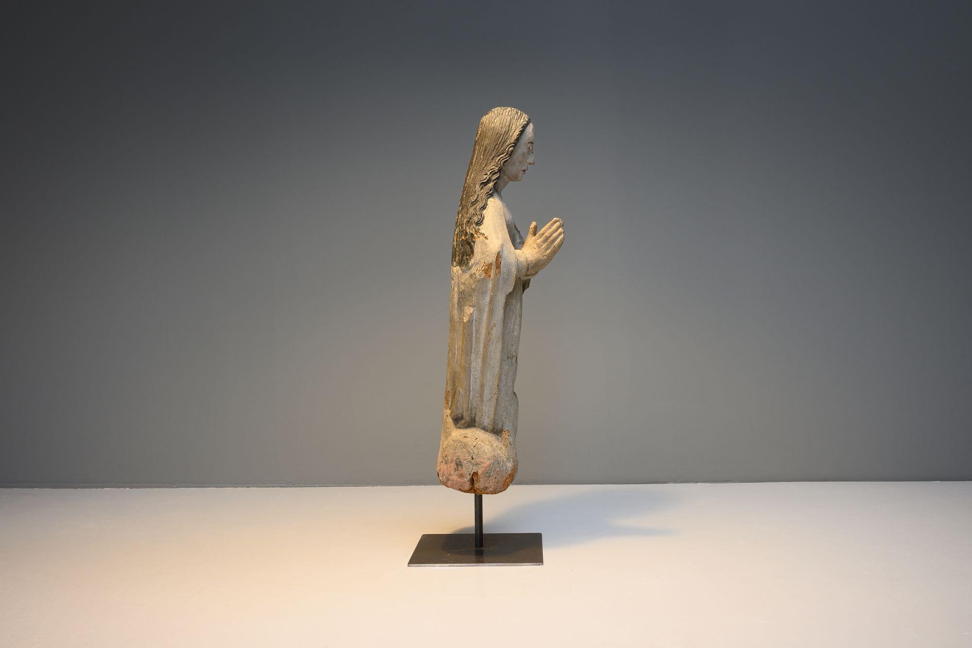Carved wooden figure on later base. Circa 1800
H 84cm x W 27cm x D 25cm