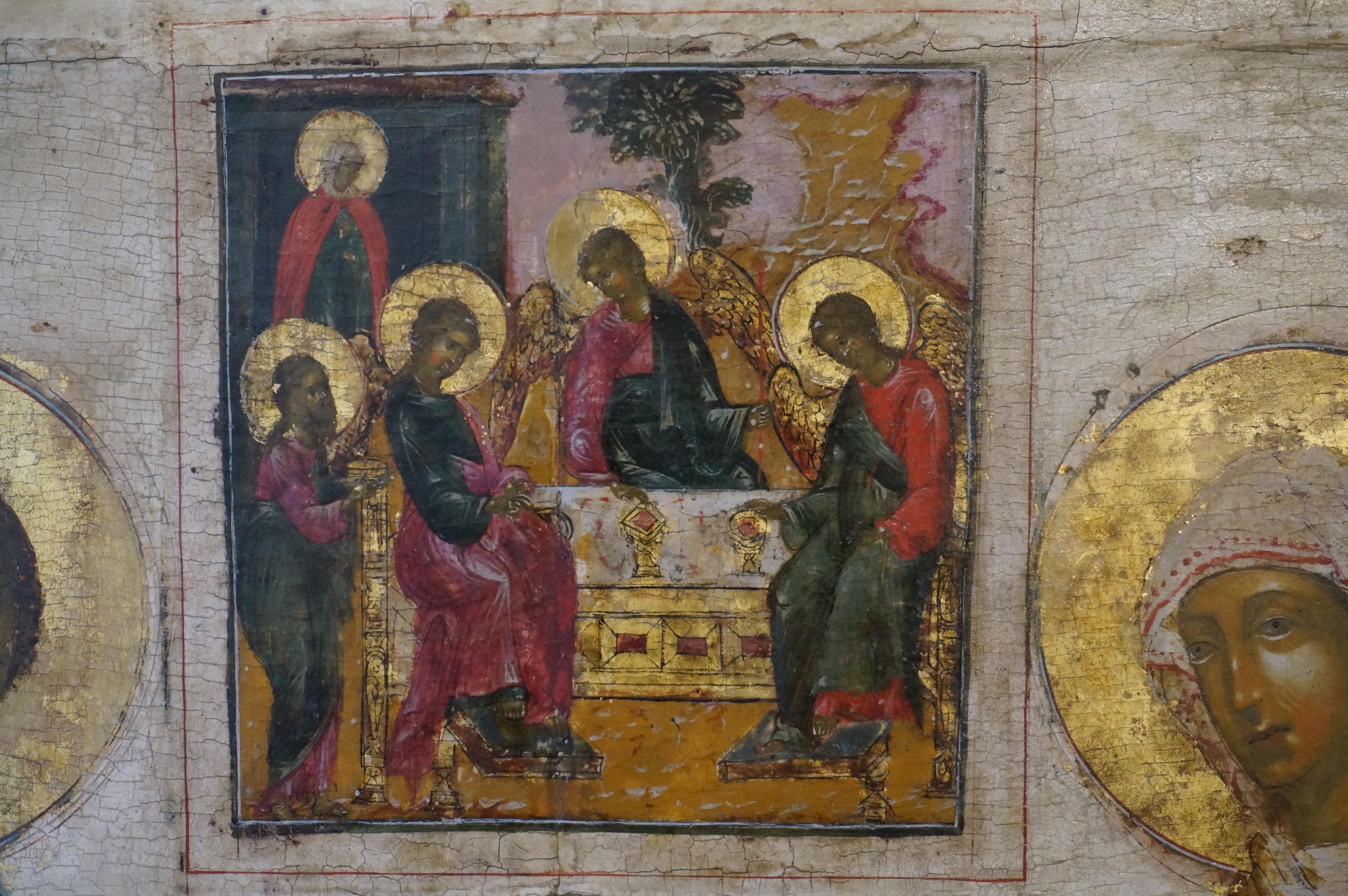 Rare icon with three chosen Saints most likely the patron saints of a family consisting of a father, a mother and a son. The inscriptions which could identify the saints are gone but most likely the depicted saints from left to right are: Saint