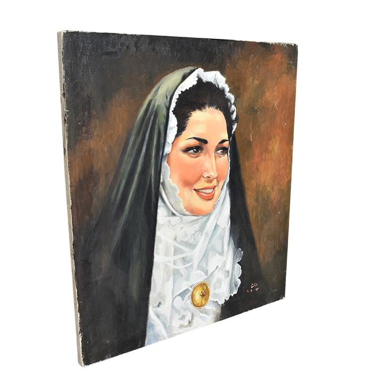 Oil on canvas portrait painting of a Catholic nun. This beautiful portrait of a woman is unframed and in wonderful vintage condition. The subject is of a Catholic sister, with black hair, dressed in her habit. A black veil with coif covers her head,