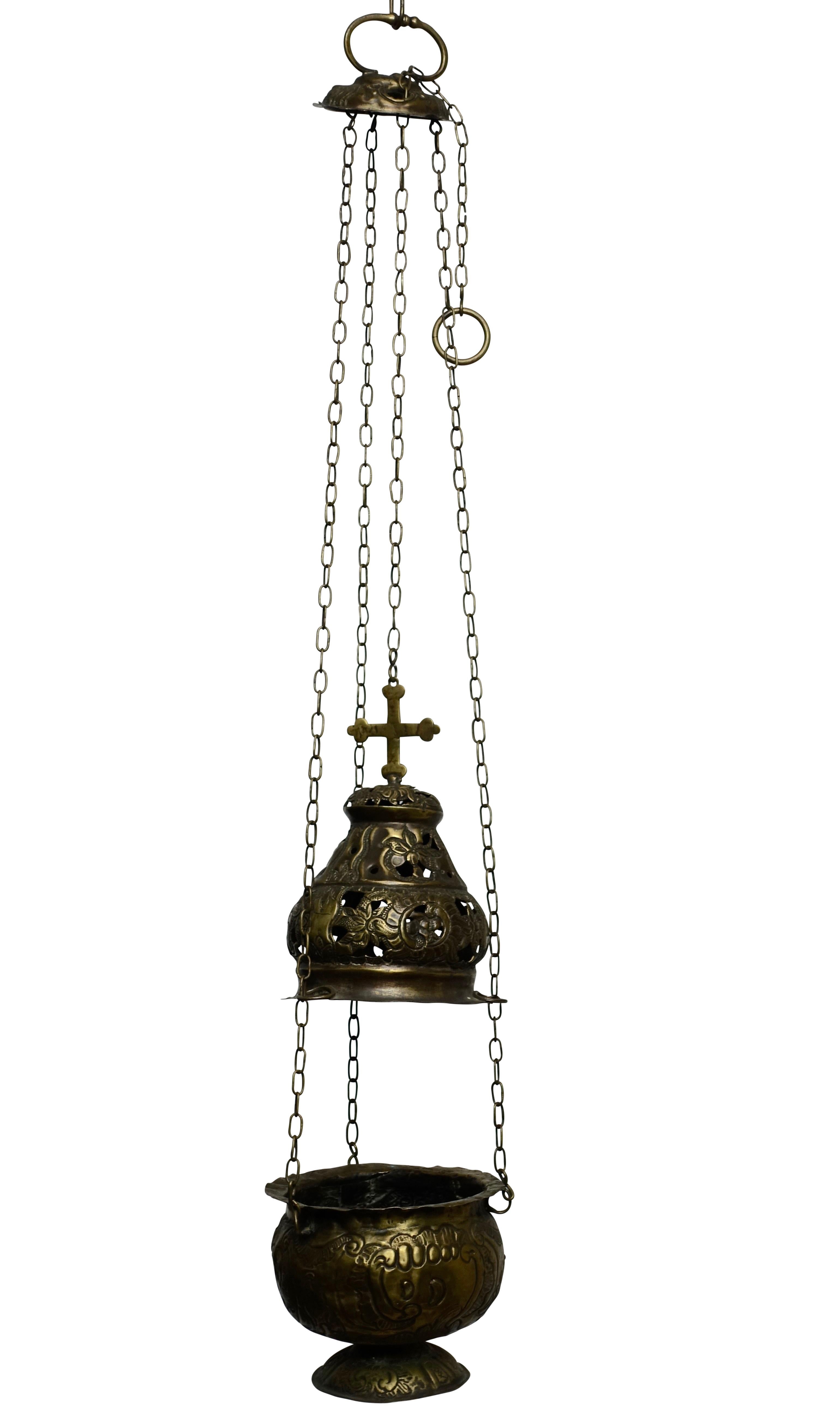 An early 19th century Spanish colonial repousse brass hanging incense burner or incensor, of very Fine craftsmanship in the Rococo manner. Overall length with chain is 30 inches.
 