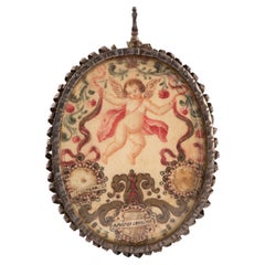 Reliquary medallion. Silver, glass, etc. Spanish school, 17th century.
