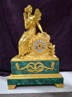 Reloj de sobremesa en bronce dorado al mercurio y malaquita, francia siglo XIX