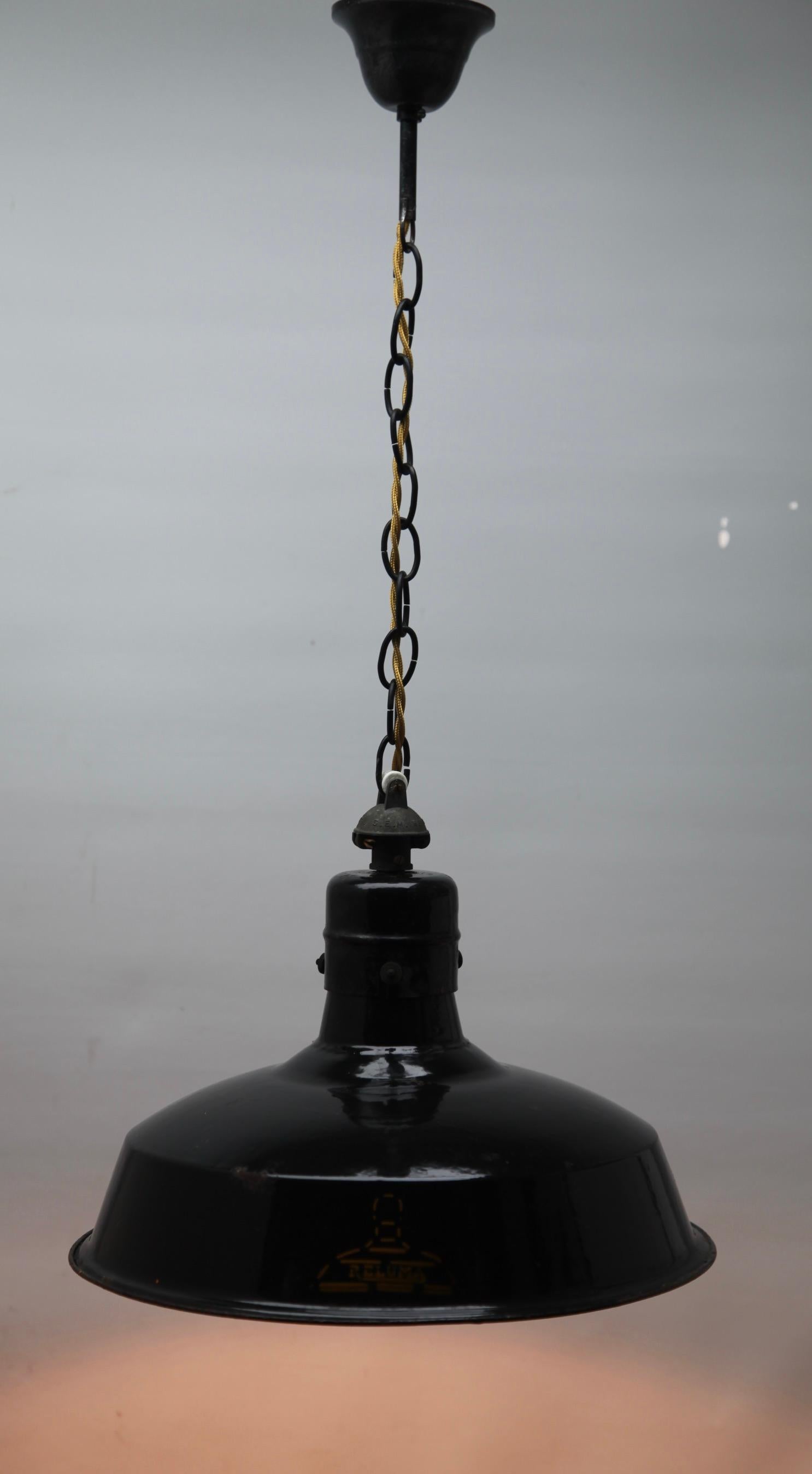 Reluma iron industrial pendant lamp, 1930s

Recently cleaned so that it In clean condition and in full working order having also 
been re-wired and provided with fittings E27
And safe for immediate usage in the World

We can adjust the height