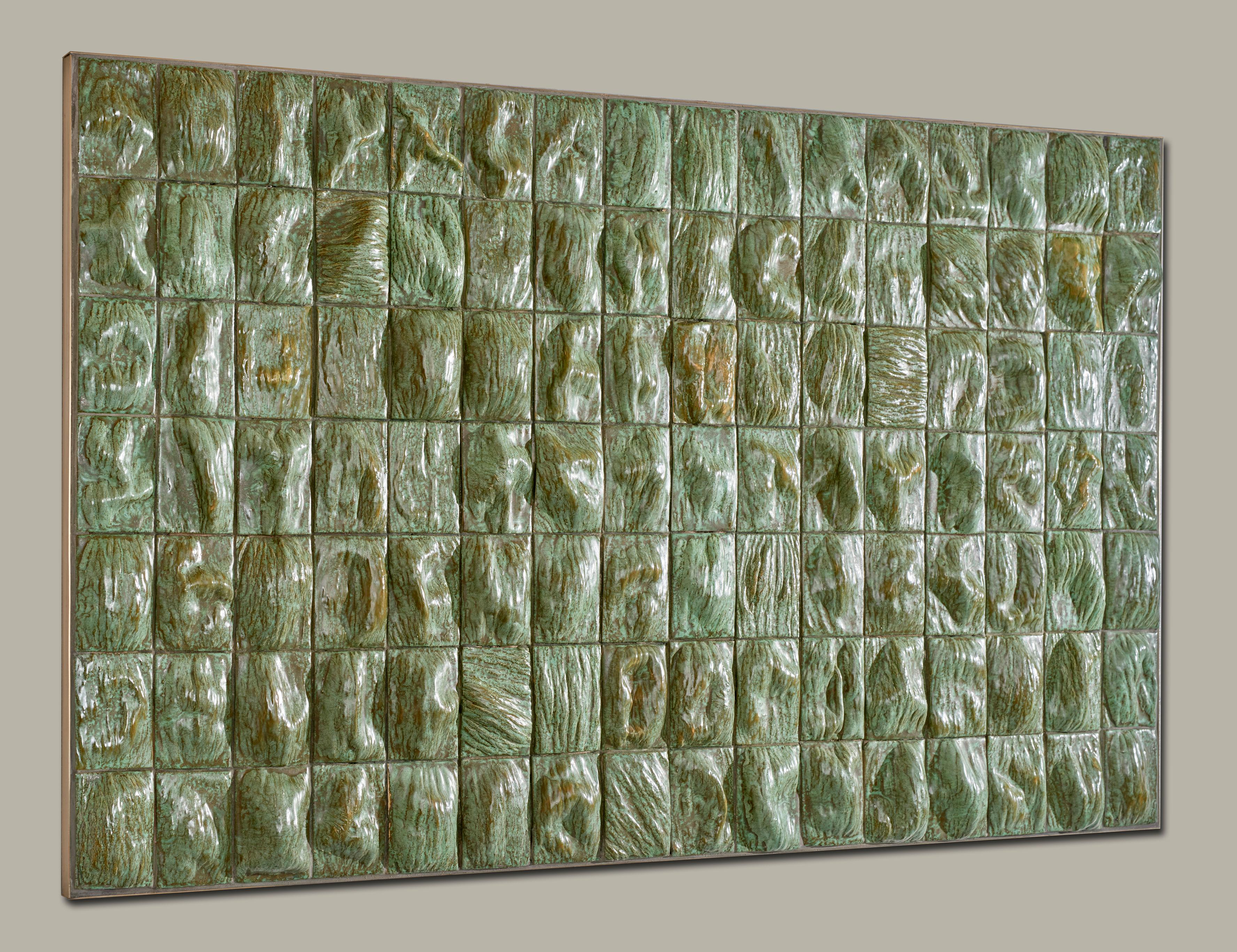 Melon Skin is a research on texture, materiality and surface depth. The Melon skin wall relief contains of 112 handcut ceramic tiles that give a sense of a melon's skin. Every tile is casted from a mold of a canary type of melon, and when taken out