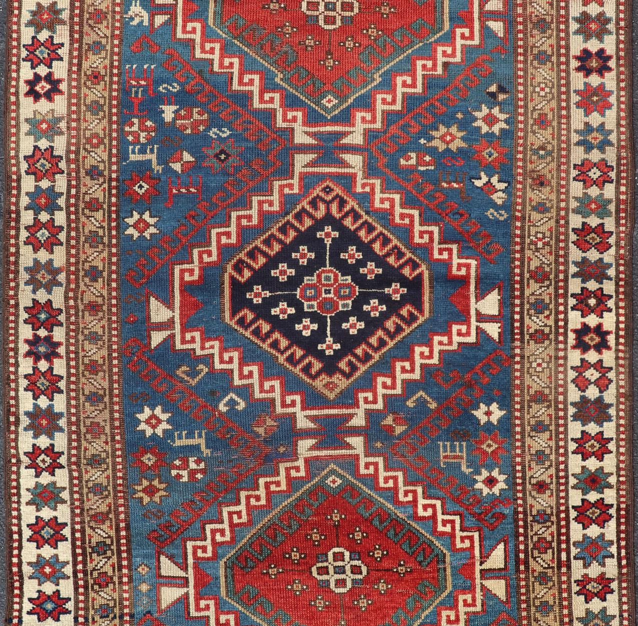 Hand-Knotted Antique Caucasian Kazak Rug in Brilliant Blue with Geometric Design Medallion's For Sale