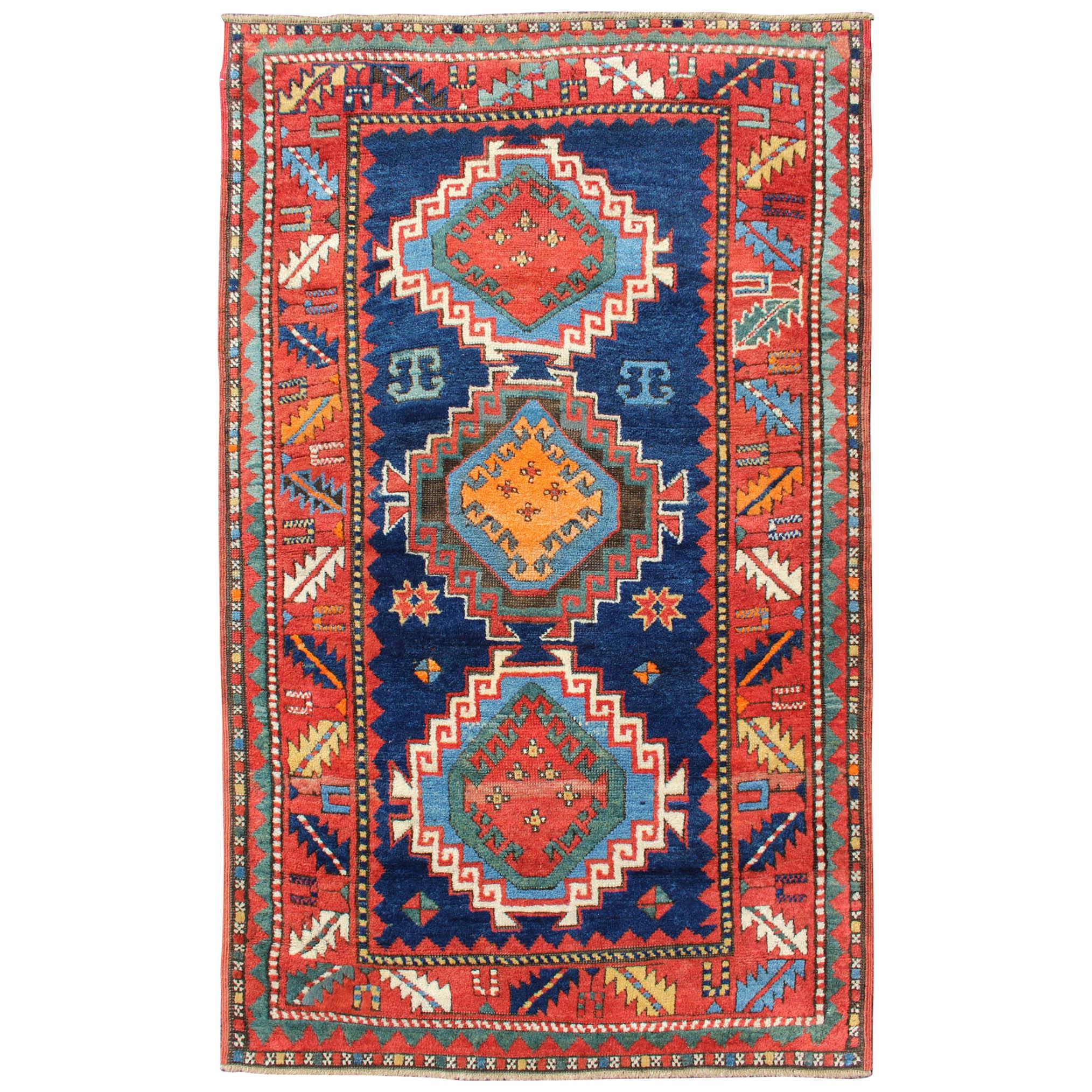 Remarkable Antique Caucasian Kazak Rug with Tribal Geometric Tri-Medallions For Sale