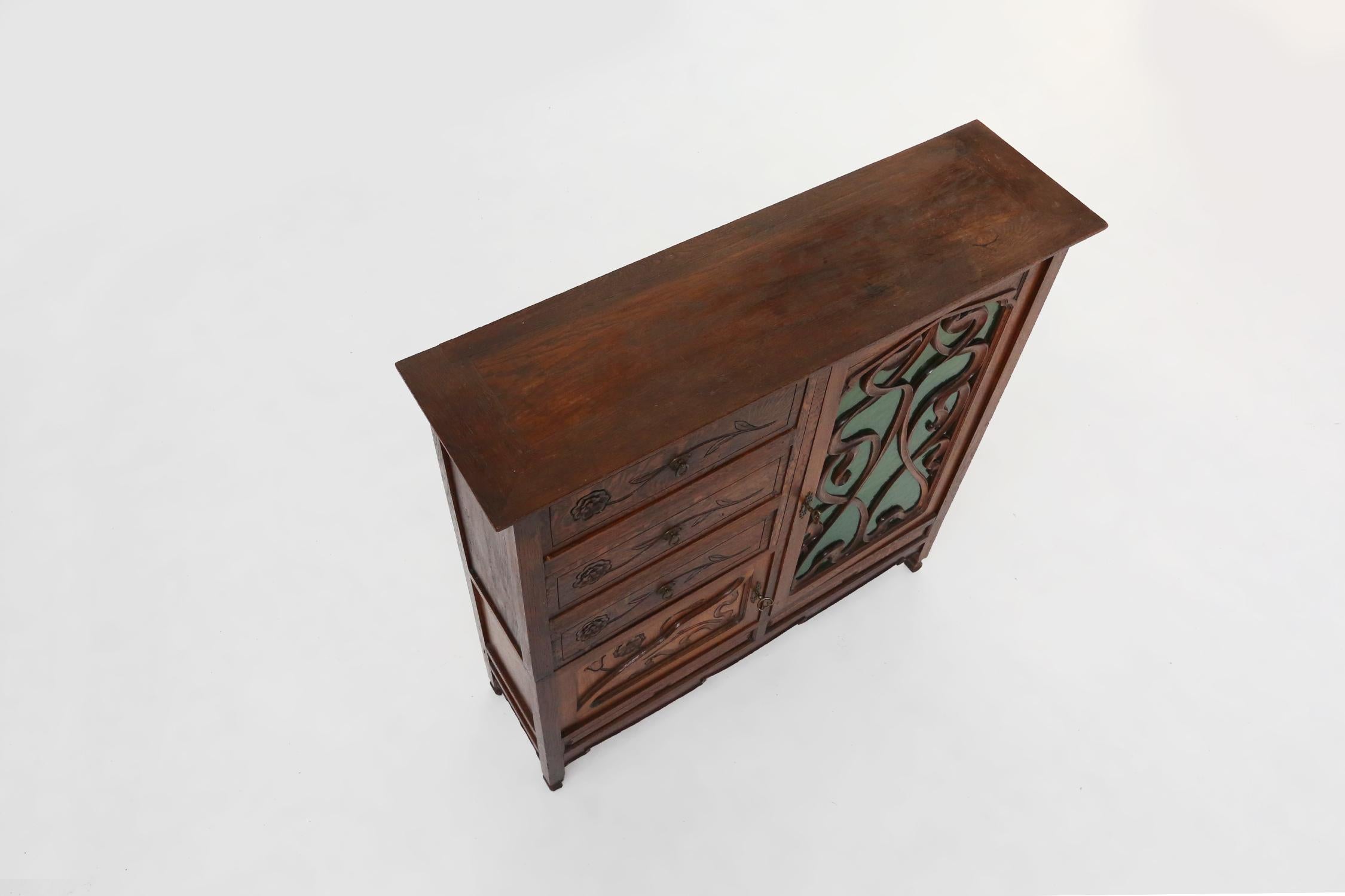Remarkable Art Nouveau cabinet in oak with green glass door, France, 1910 For Sale 11