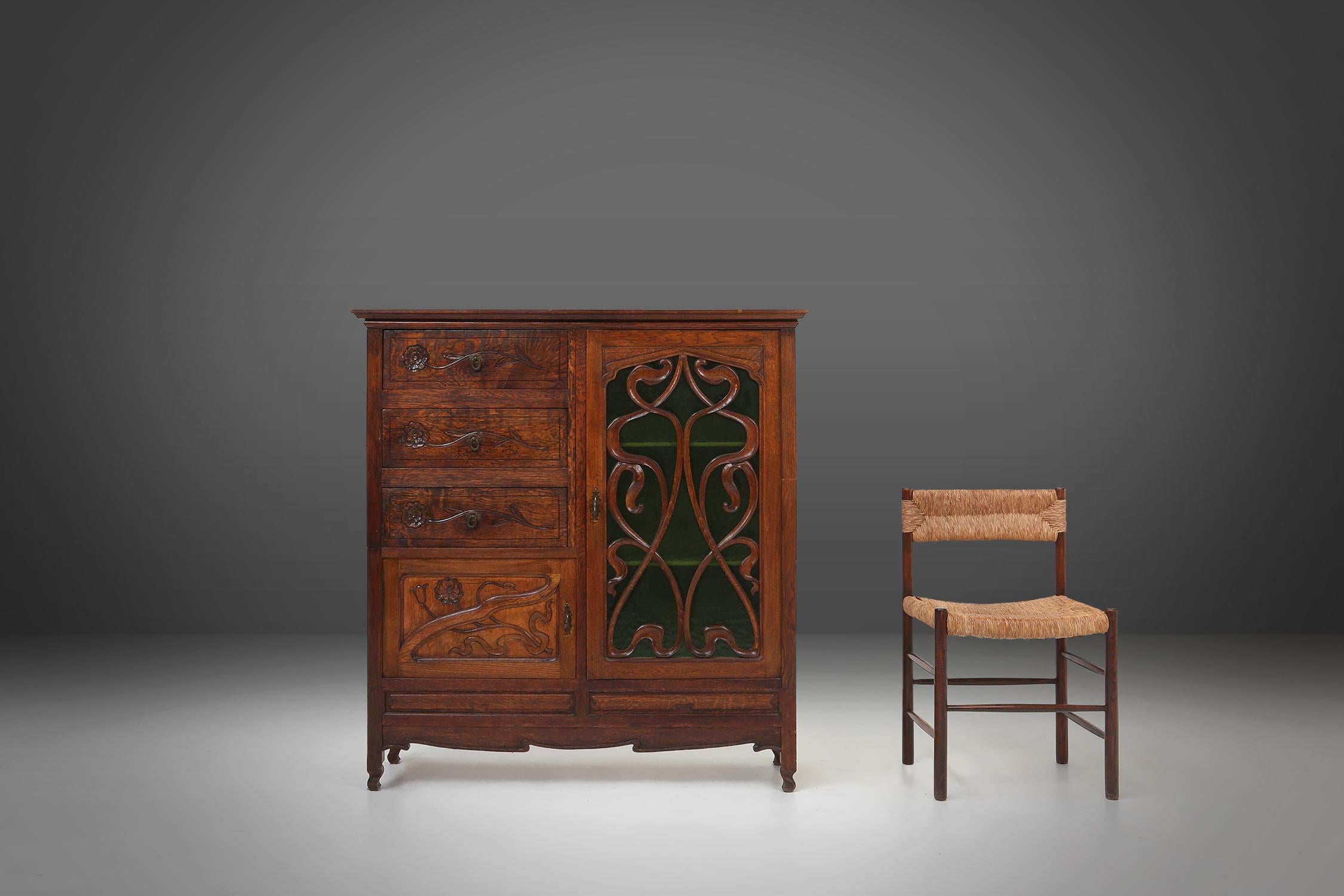 French Remarkable Art Nouveau cabinet in oak with green glass door, France, 1910 For Sale