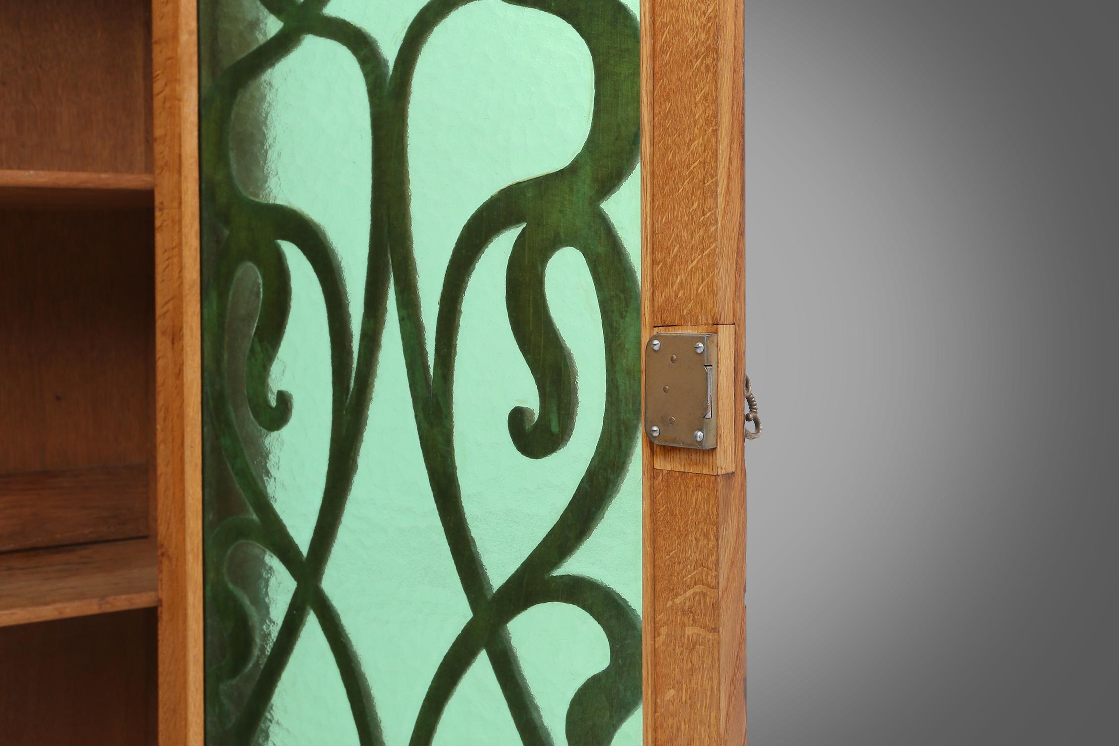 Remarkable Art Nouveau cabinet in oak with green glass door, France, 1910 In Good Condition For Sale In Meulebeke, BE