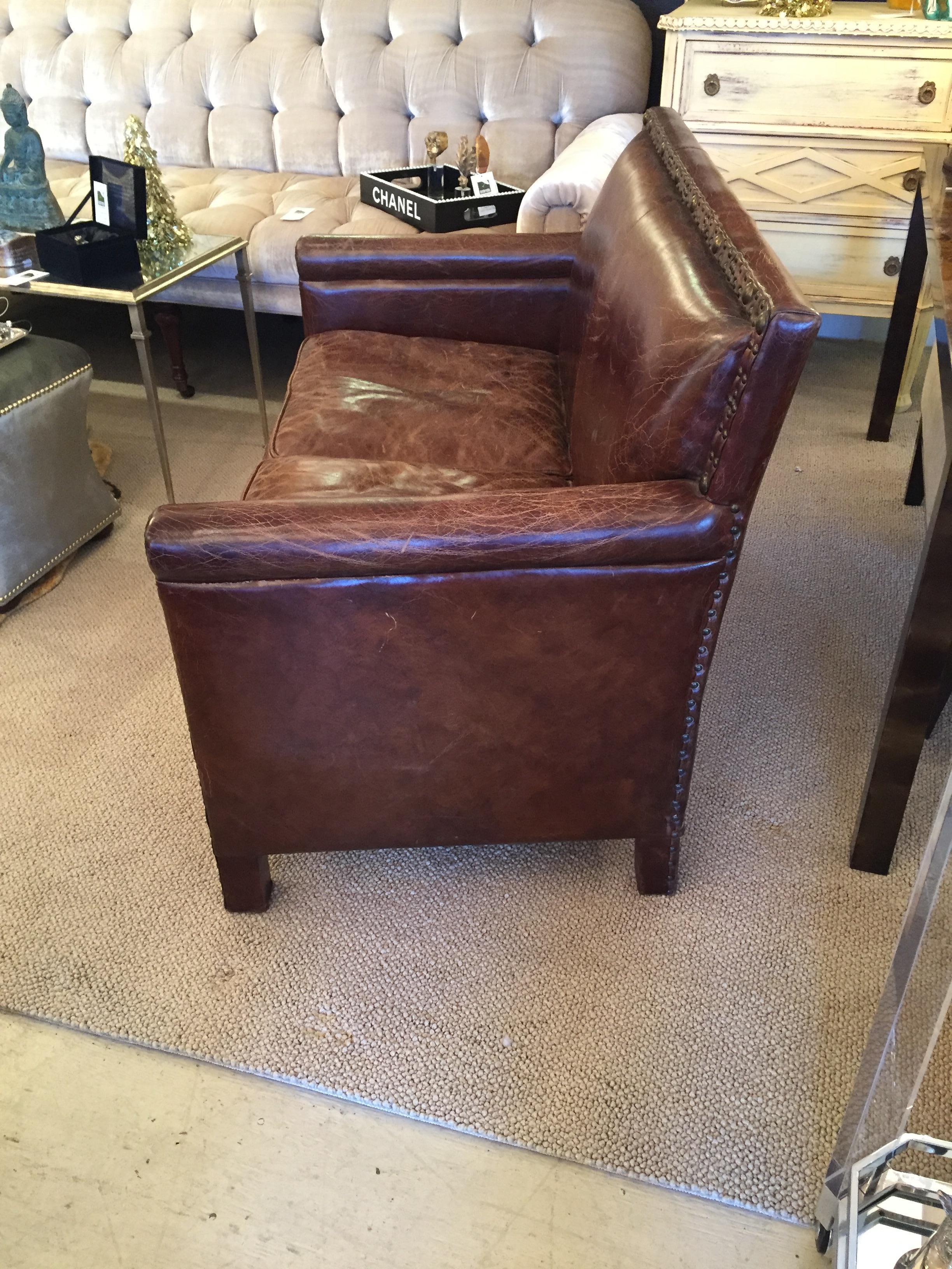 Remarkable Distressed Leather Loveseat with French Brass Nailheads 1