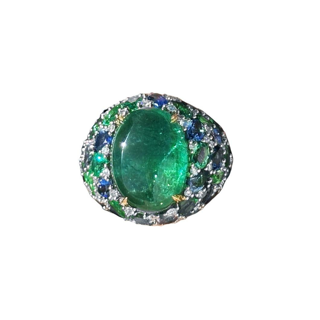 Discover the allure of the Remarkable Emerald Sapphire Diamond 18K Yellow Gold Ring, meticulously crafted from 18K yellow gold and adorned with dazzling diamonds (0.67 ct), radiant emeralds (22.56 ct), and vivid sapphires (5.47 ct). Symbolizing
