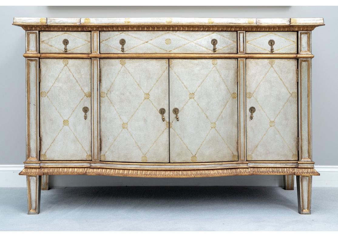 An incredible Pair of Large and very Decorative Silvered Leather Chests from John-Richard. Pair of impressive John Richard silver gilt credenzas with gilt lattice and floral decoration throughout. The cabinets are accentuated by smooth gilt and