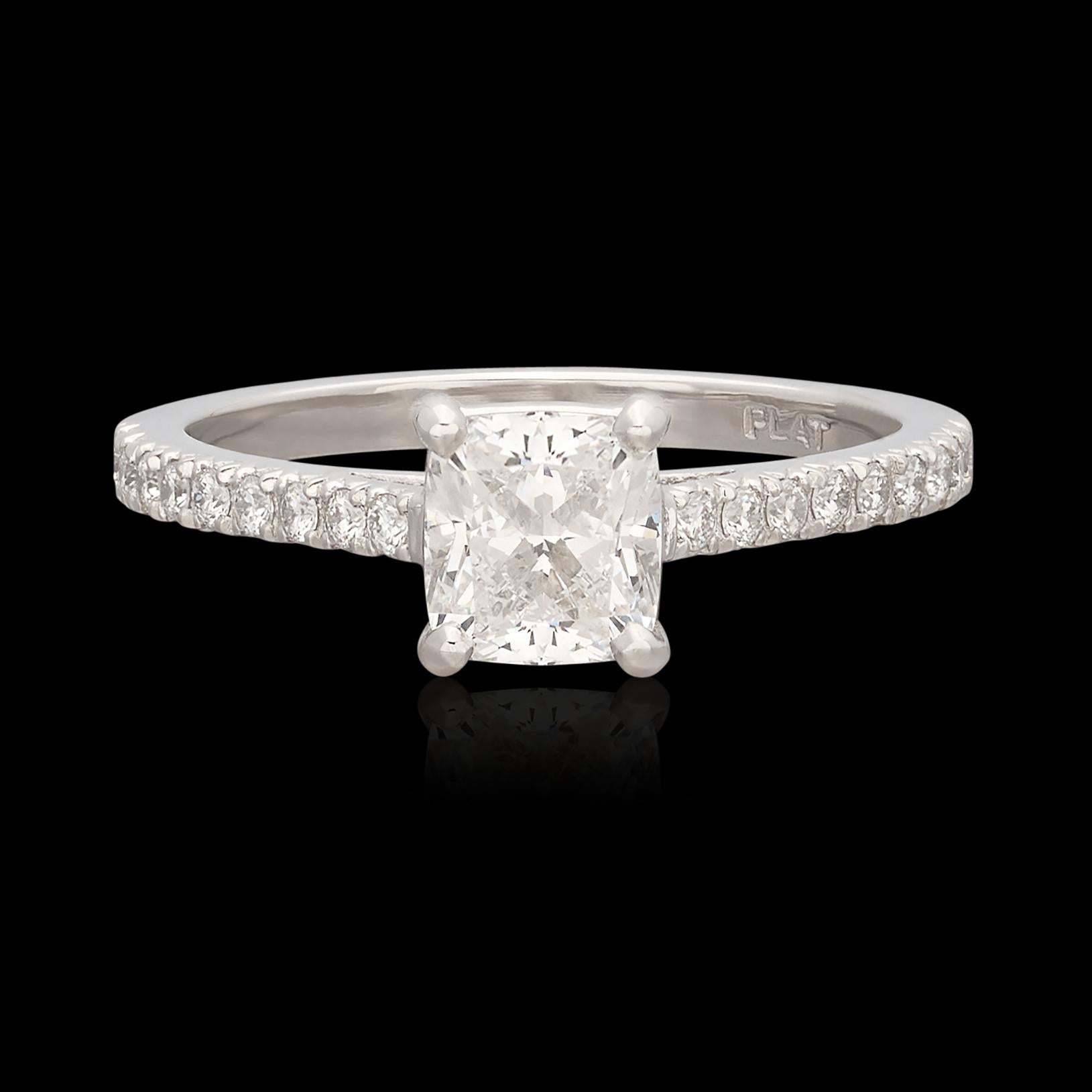A near perfect diamond expertly set in a truly beautiful ring. This Platinum stunner features an exceptional Cushion Cut natural diamond weighing .95 ct and graded by the Gemological Institute of America as F color and VS2 clarity with Excellent cut