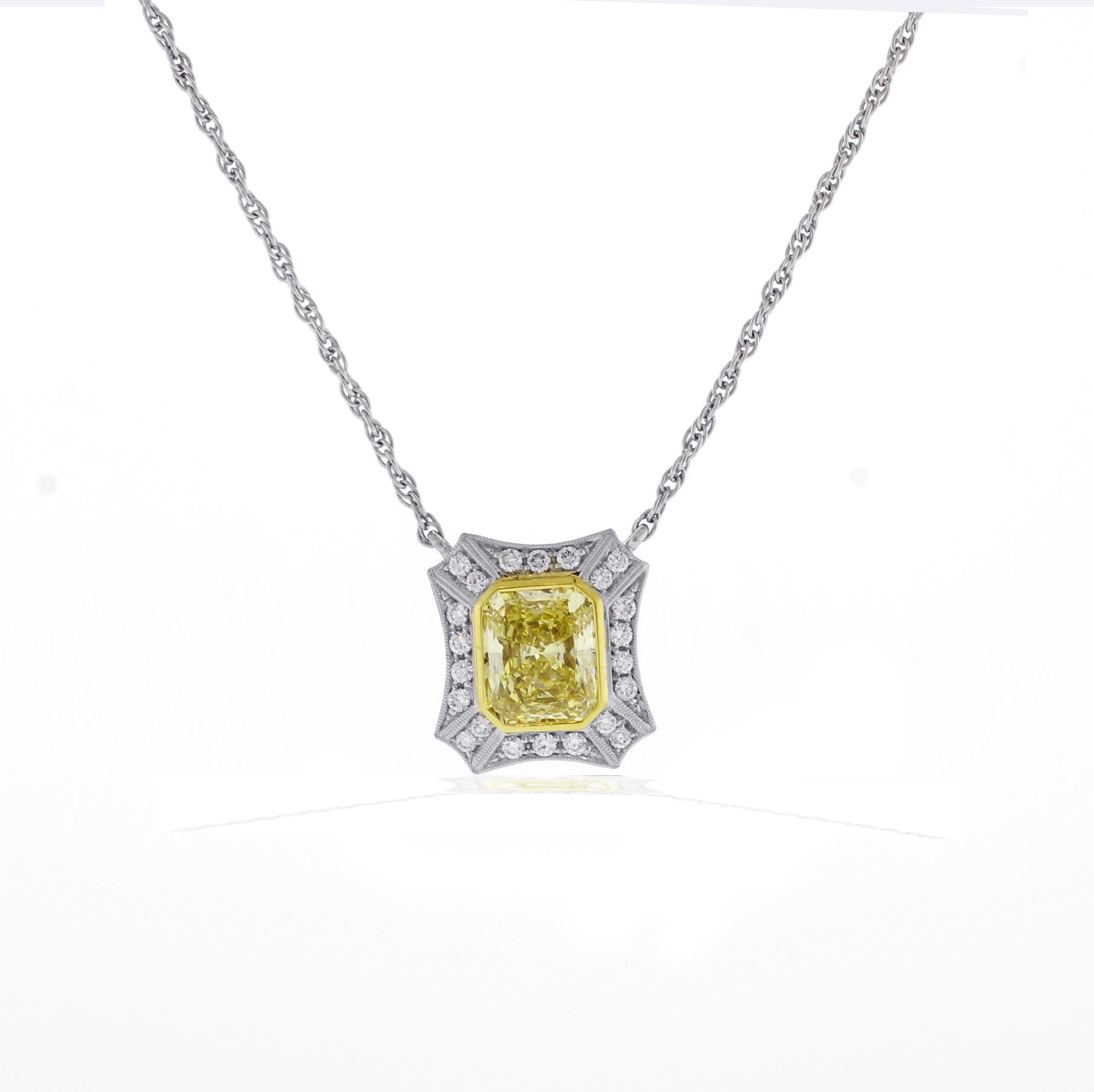 From the master jewelers of Pampillonia, this highly prized natural fancy yellow Radiant cut diamond weighing 2.46 carats. The diamond rests in a handmade platinum micro  pave setting with an additional twenty two brilliant cut diamonds. GIA gem