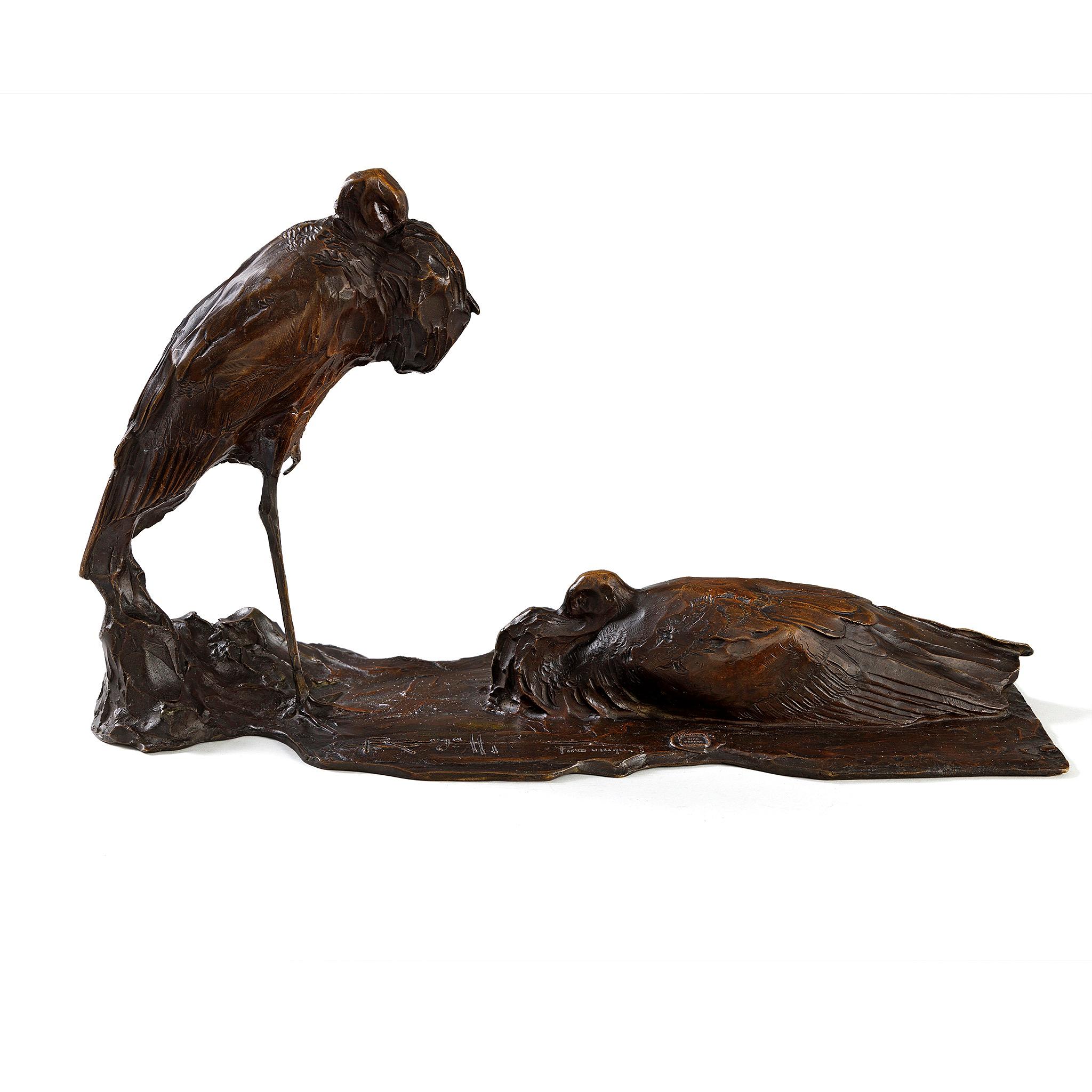 Rembrandt Bugatti's striking bronze depicts a pair of elegant white storks. The male stork, positioned on the left, gently rests its head upon its soft breast while tucking one of its feet close to its body to conserve warmth. Meanwhile, the female