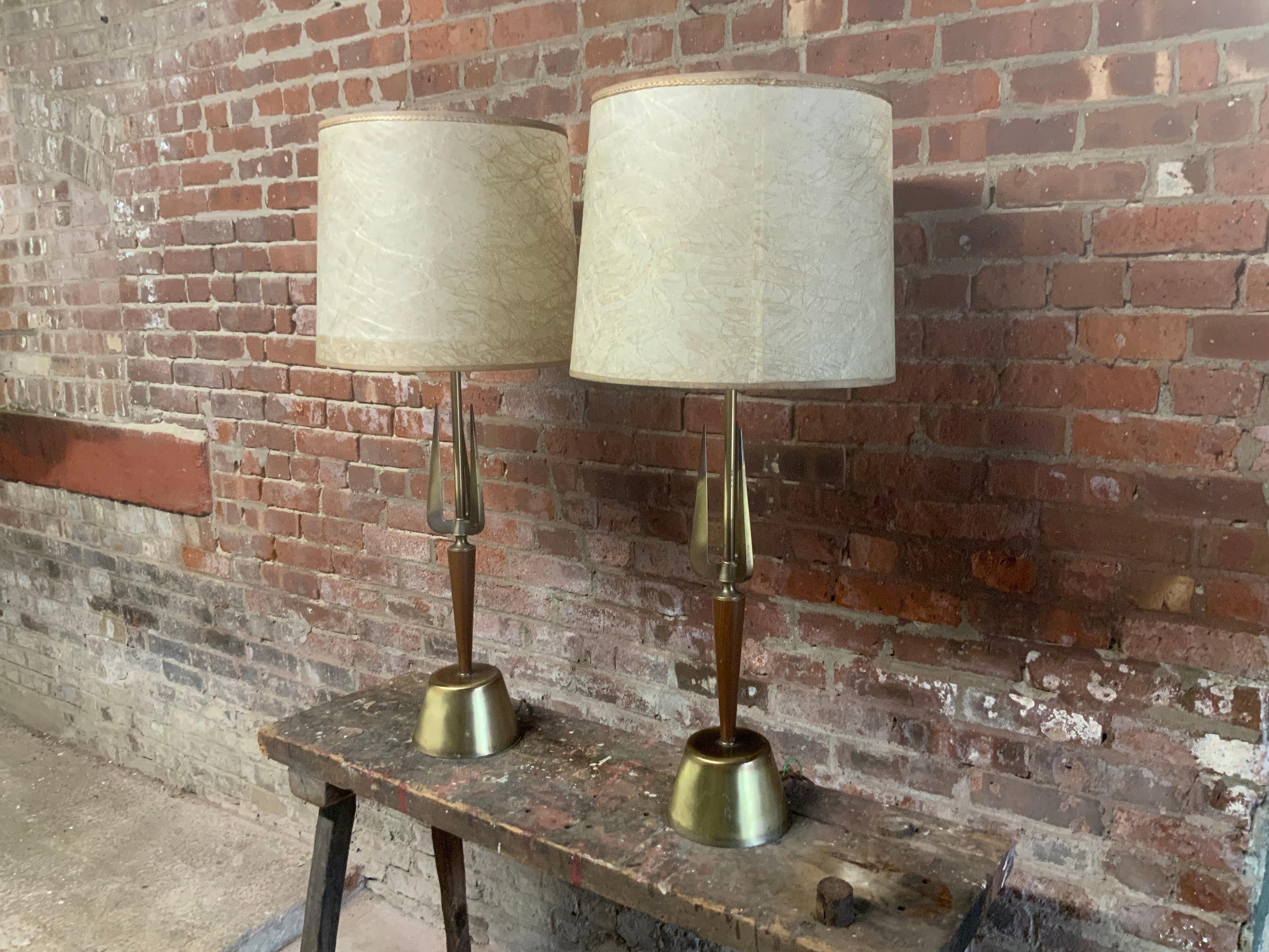 Pair of signed Rembrandt triton motif table lamps. A wonderful pair of table lamps that feature a 