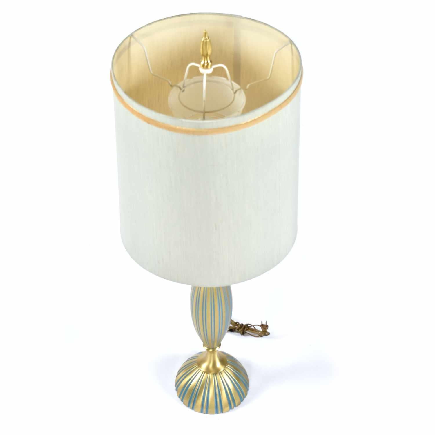 Outstanding Mid-Century Modern Rembrandt table lamp with original shade. This is one of the best condition vintage lamps we’ve come across. It’s quite uncommon to find a metal lamp with so little oxidization after seven decades! The lamp shade is
