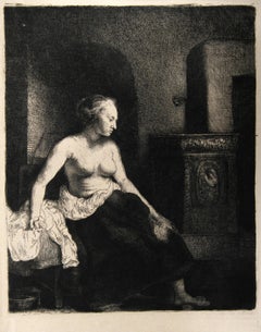 Used Woman Seated Beside a Stove  (B197), Heliogravure by Rembrandt van Rijn