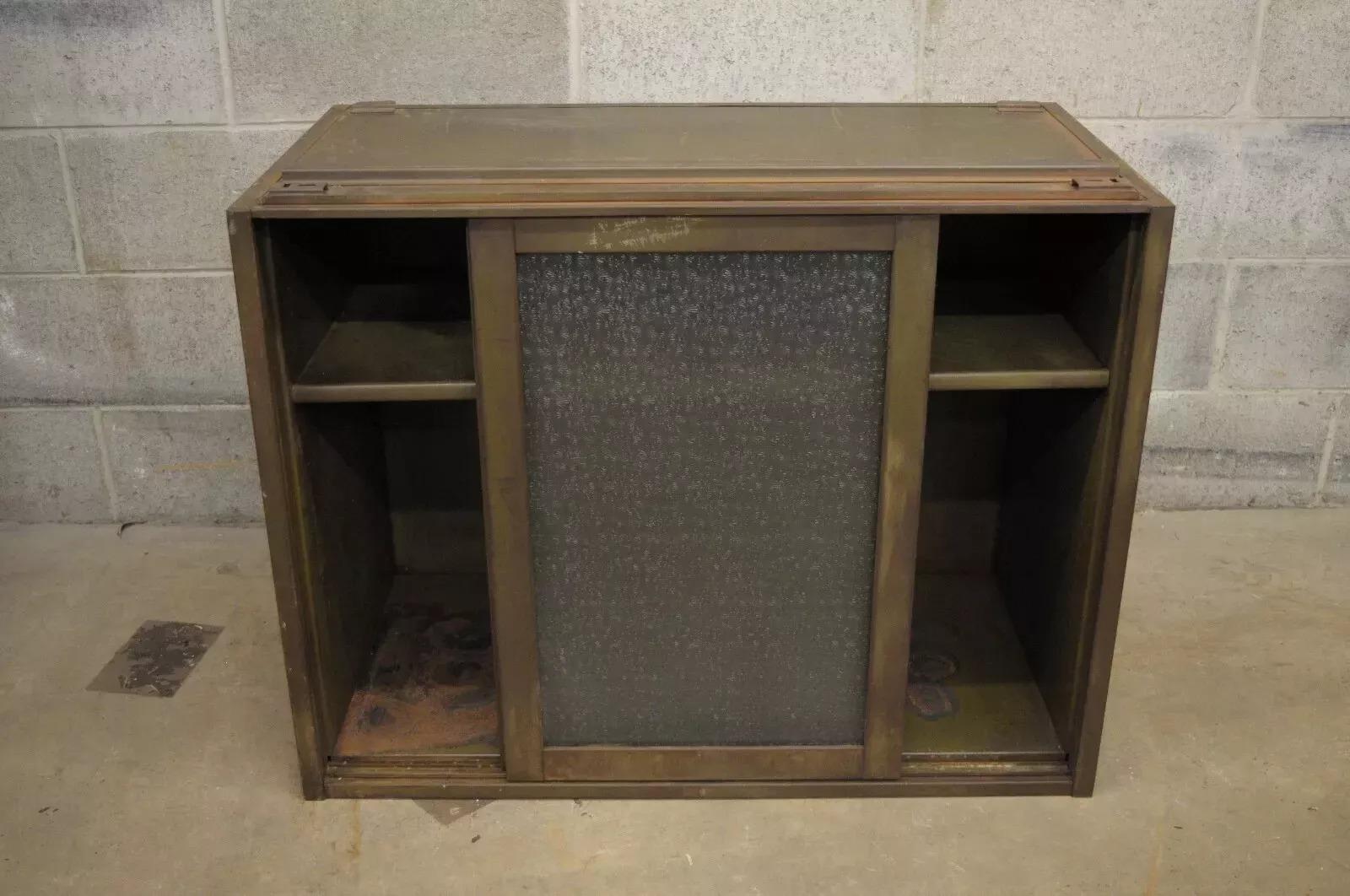 Vintage Remington Rand Industrial Green Steel Metal Stacking Barrister Storage Cabinet (B). Item features steel metal construction, 2 sliding textured and frosted glass doors, 2 adjustable shelves, army green distress painted finish. Circa Mid 20th
