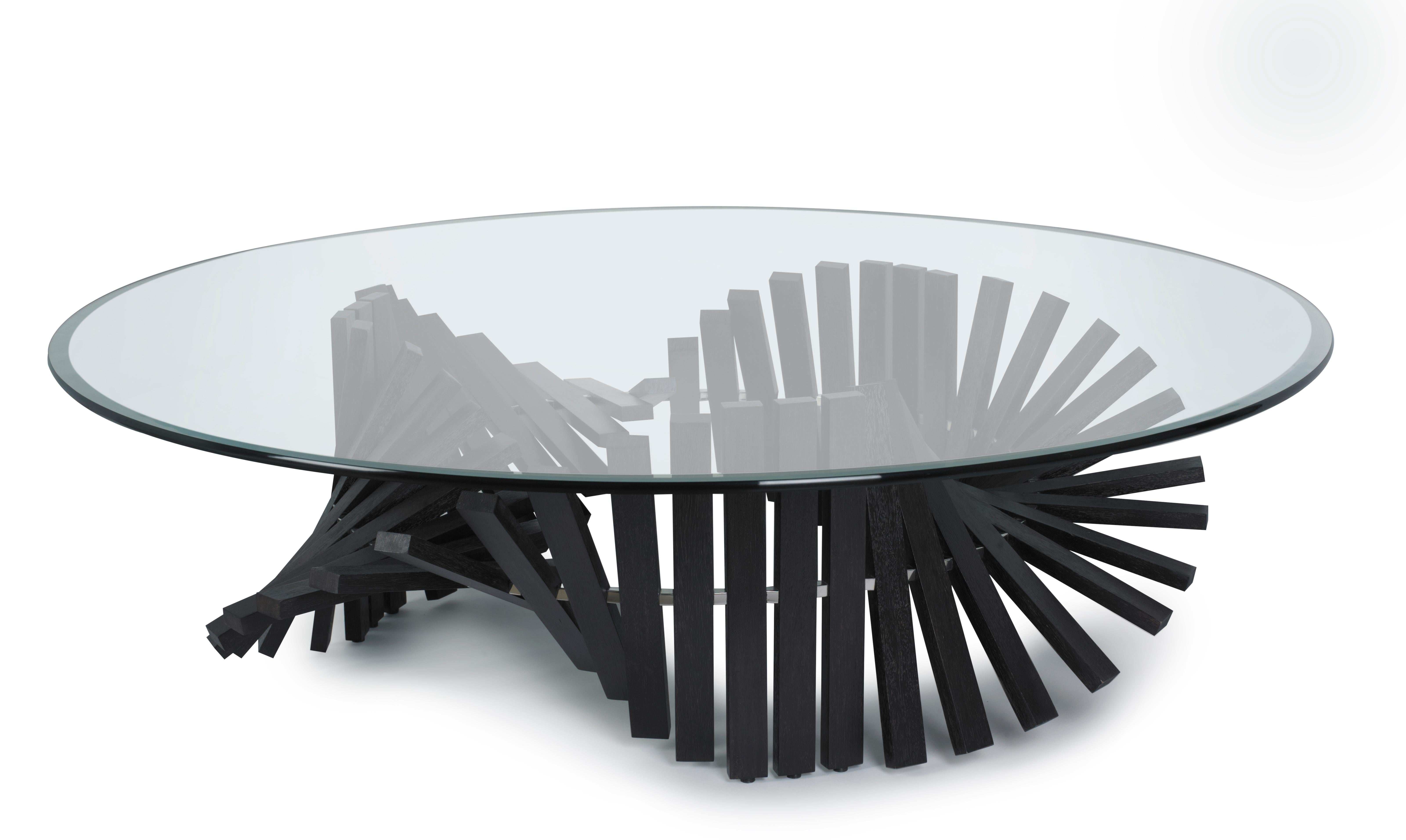 The cocktail table base is a marvel of natural wood, featuring captivating undulations that create an extraordinary design. Designed by the visionary Vito Selma, known for his ability to conceive the unimaginable, this piece is a testament to his