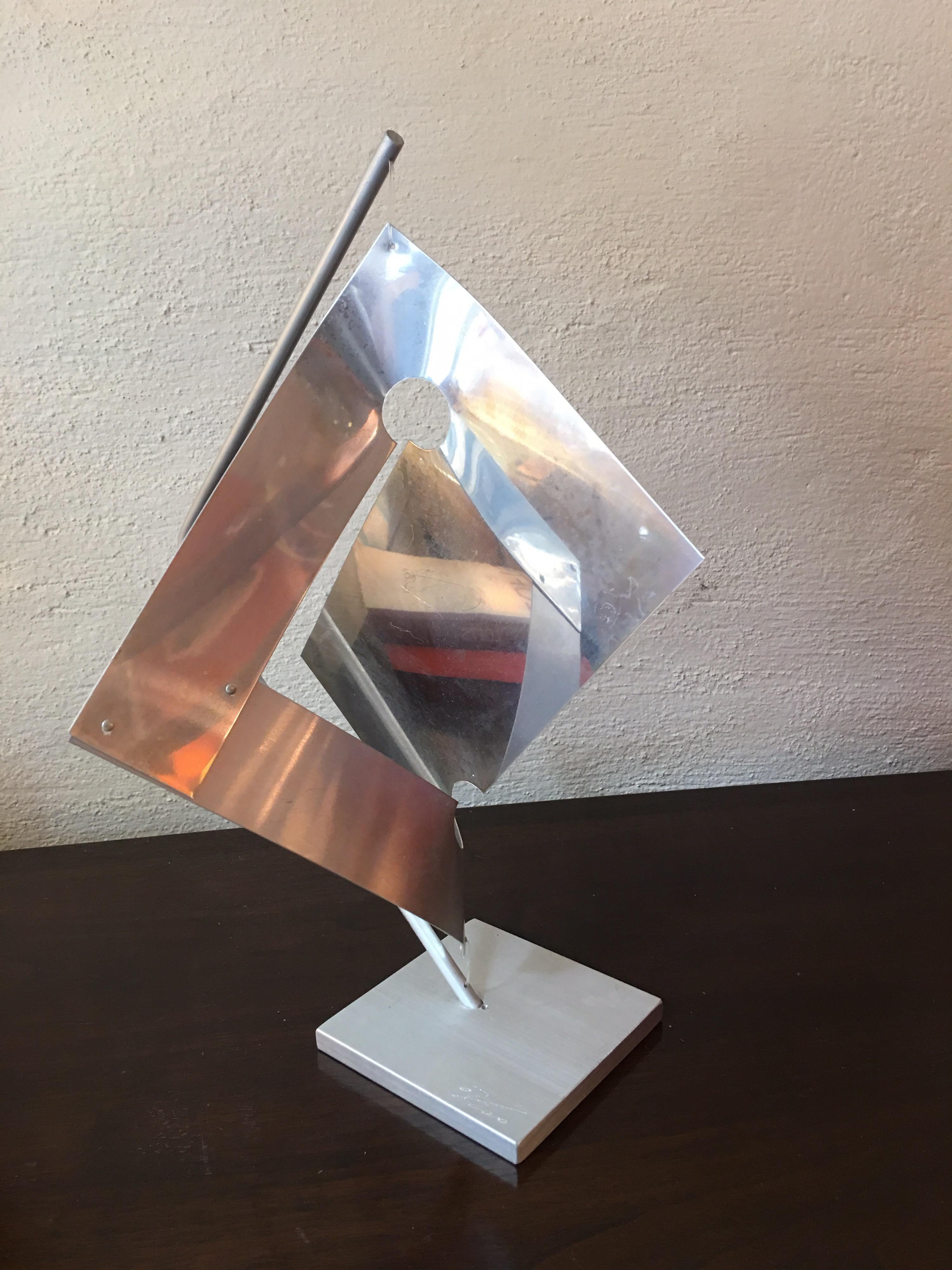 Remo Saraceni Marquette sculpture, signed and numbered 1977 67/200. Aluminum study held in place with fish line top and bottom.