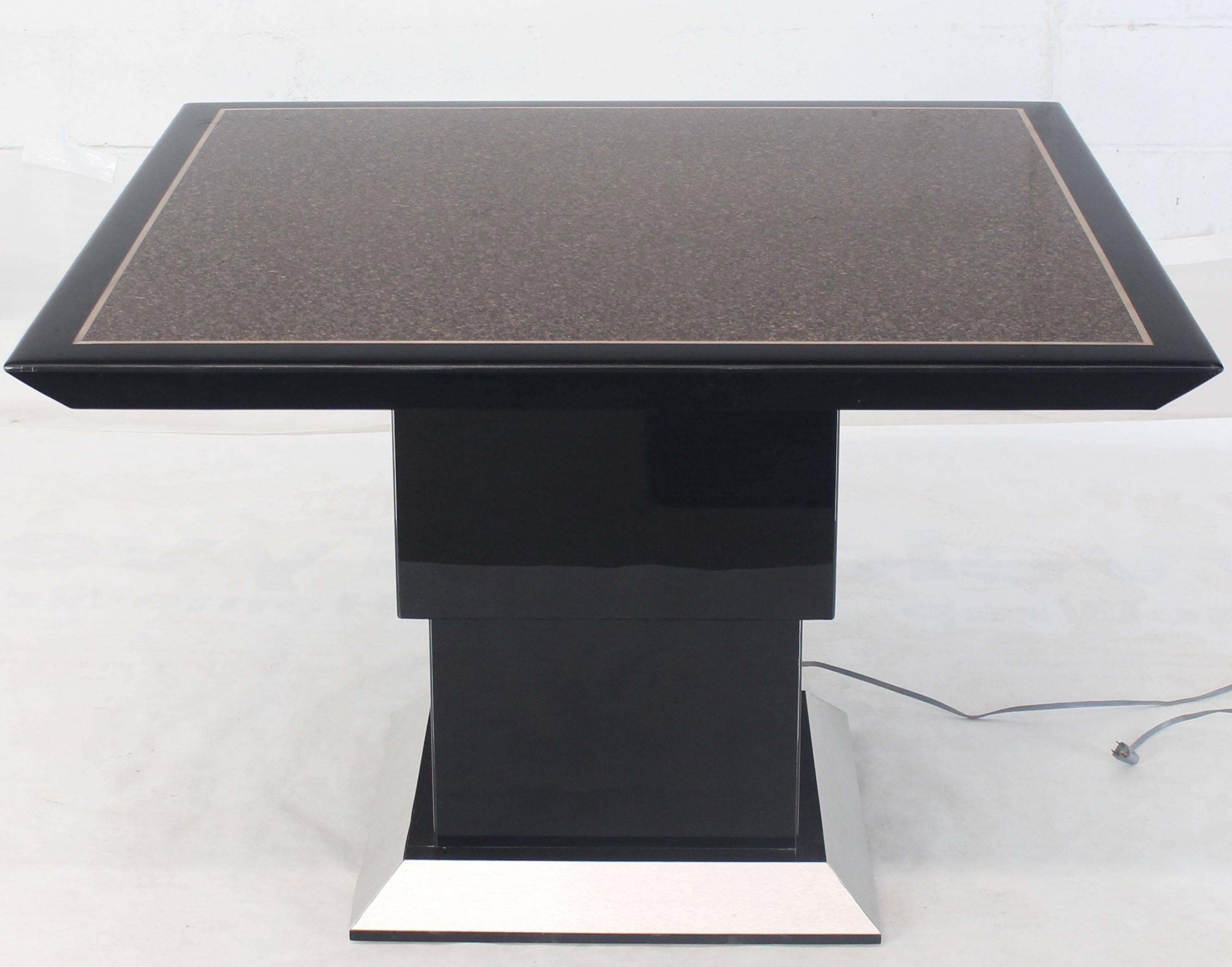 Square adjustable height faux granite finish dining coffee or game table. Unique custom built design adjustable height table with a remote control. Beautiful black lacquer finish.