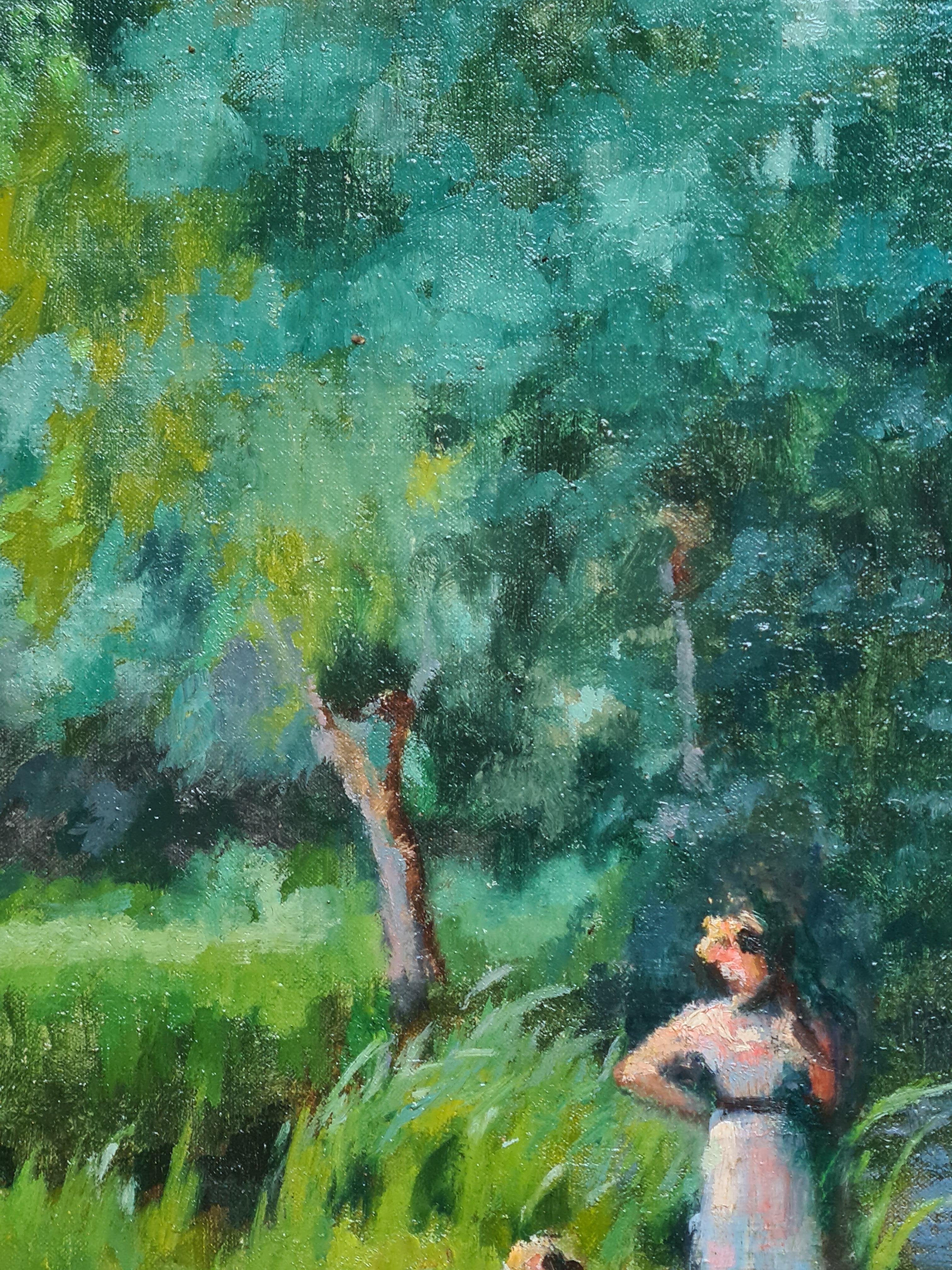 Huile sur toile française du début du 20e siècle représentant un pique-nique au bord d'une rivière par René Albert Raphaël Gouin. Le tableau est signé en bas à droite et il y a des tampons au pochoir sur les châssis arrière, provenant d'une
