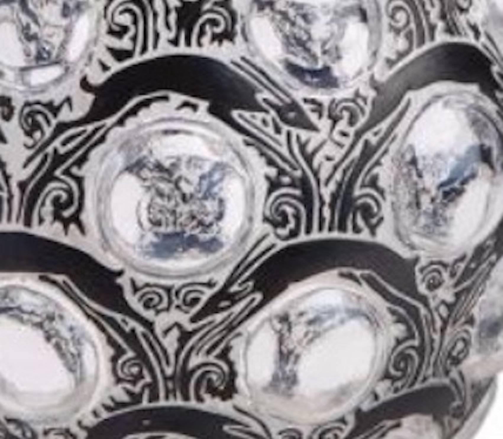 Clear and frosted antilopes motif glass with rows of clear cabochons rosted and black enameled antelopes motif glass; bulbous frosted and black enameled antilopes motif glass running around rows of clear cabochons and under an undecorated neck and