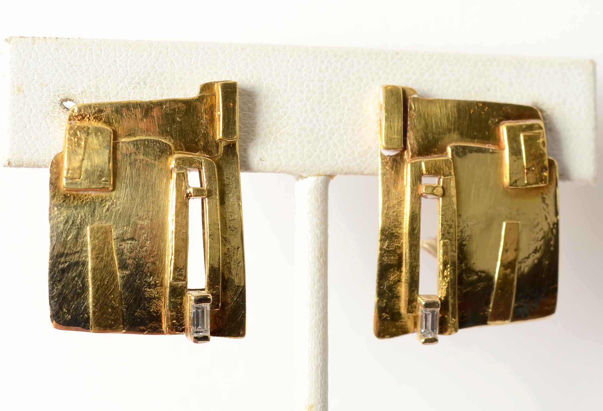 Abstract design earrings by American designer, Rena Koopman. The earrings are made of 18 and 22 karat gold with the sense of abstract painting often seen in Koopman's work. A small rectangular diamond at the bottom of each dresses up the earrings