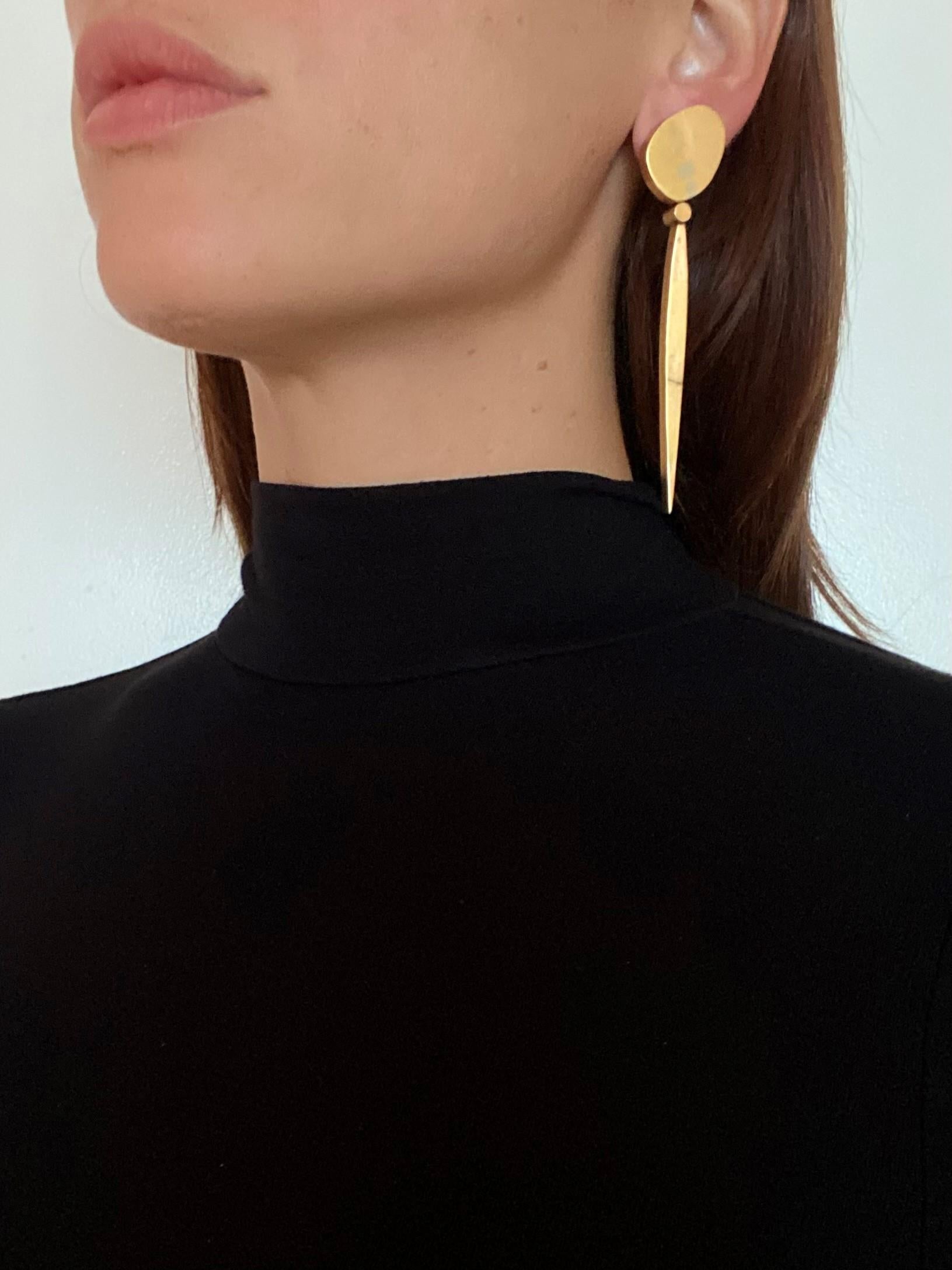 Convertible drop earrings designed by Rena Koopman.

Beautiful one of a king artist studio pieces, created by the artist goldsmith Rena Koopman. These convertible day and night drop earrings has been crafted in solid yellow gold of 18 karats with