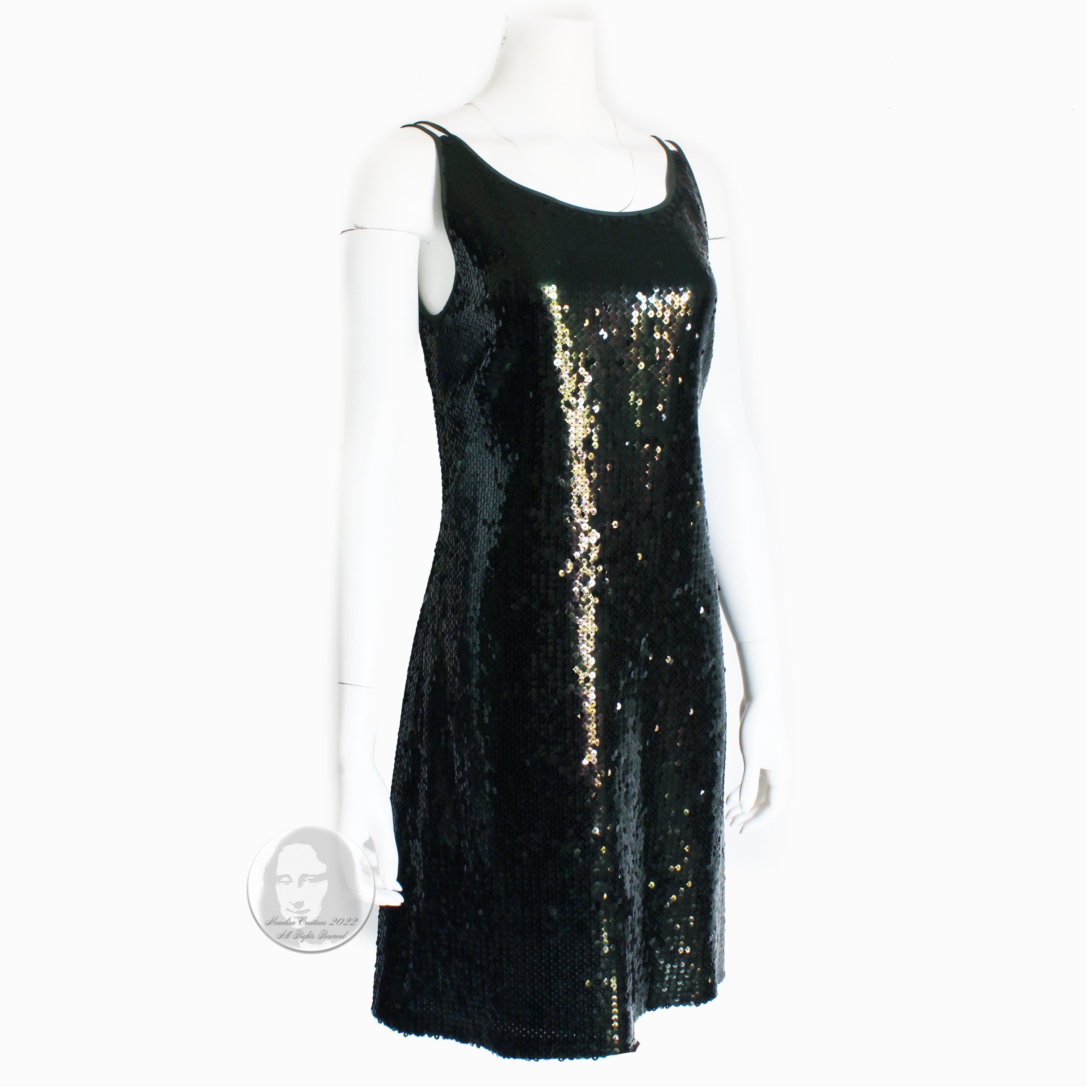 Sparkling Rena Lange cocktail dress, likely made in the 90s.  Made from moss green silk crepe, it's covered in deep green sequins throughout and features a chic low cut back.  Quality made, it's the perfect party or formal event dress. 