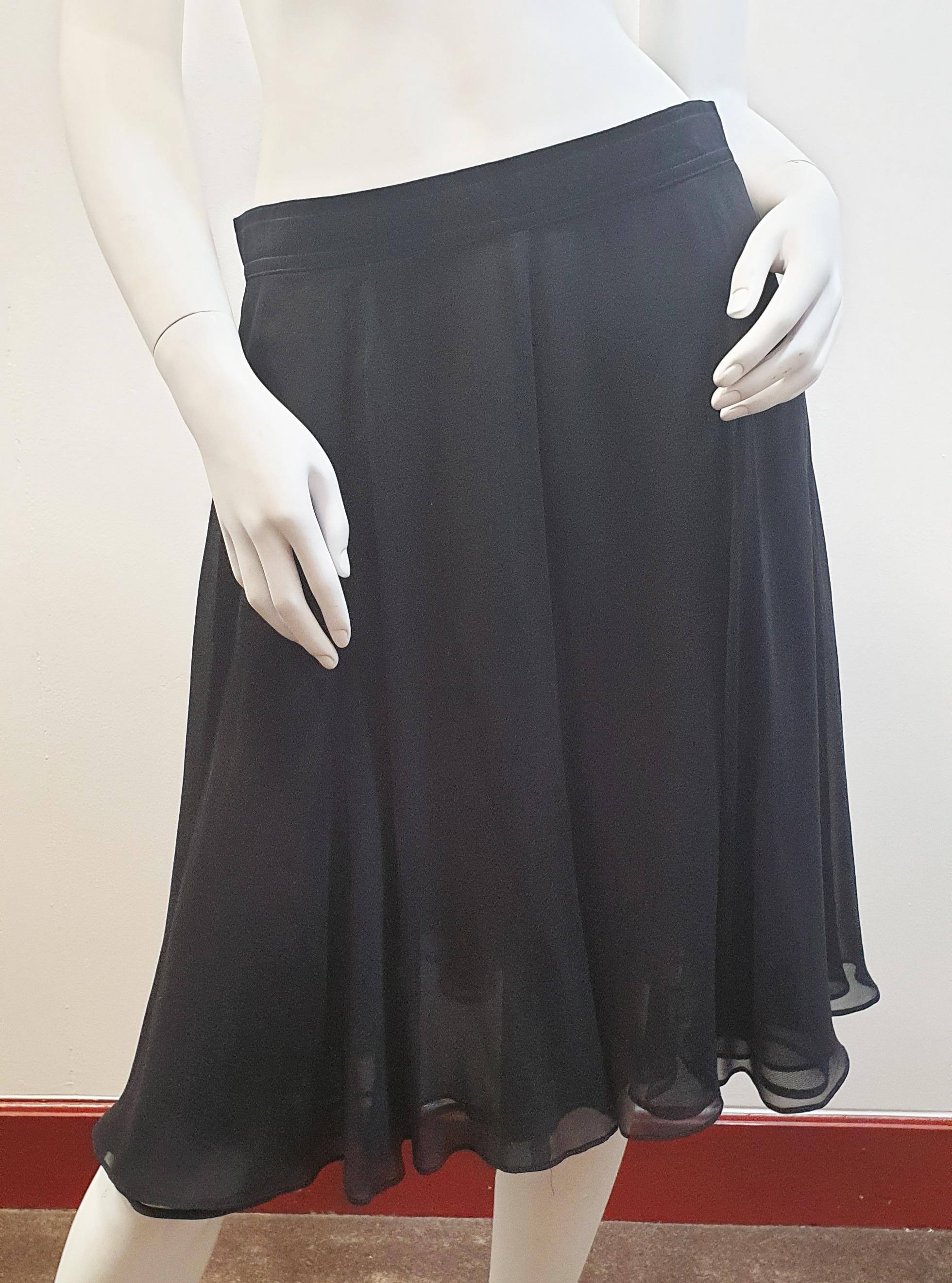 Rena Lange 
Tulle and Viscose Black night skirt seemed to the waist with rayon 
Size 40 Europe, Medium-Tall US
Matching top also on sale 
Rena Lange was founded in 1916 as a lingerie label M. Lange, and is ever since lead by the family Gunthert. In