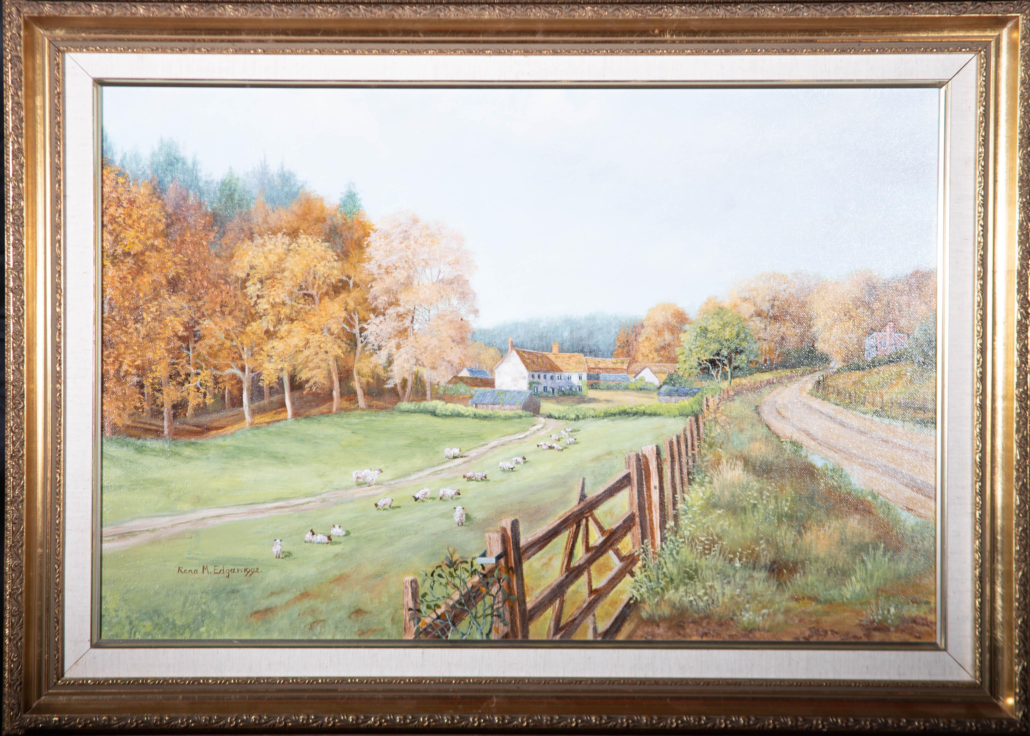 A landscape depicting a flock of sheep grazing in front of historic farm buildings. Presented in an ornate gilt-effect frame with a linen slip and a gilt-effect inner window. Signed and dated to the lower-left corner. Inscribed with the title to the