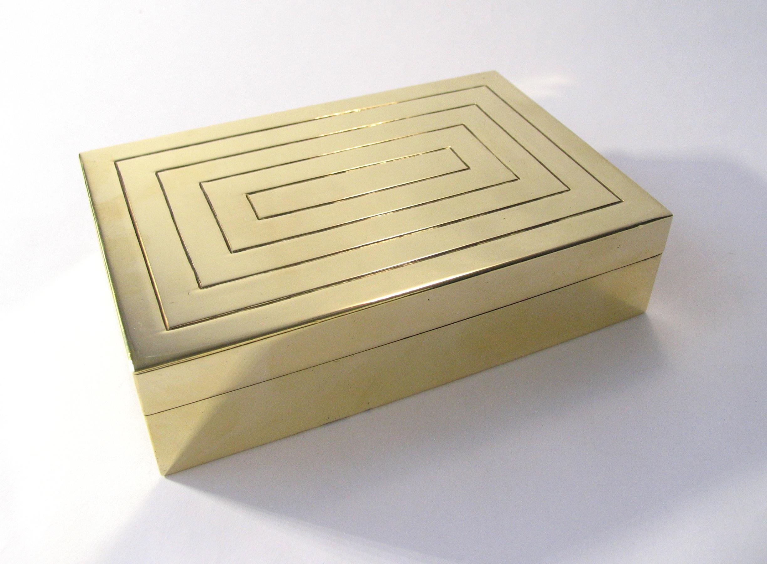 Gorgeous Art Deco engraved and polished brass jewelry box with wood lining.
Handcrafted and signed by Austrian studio metalsmith J. Braun, with hammer logo.
Stamped Rena, retailed at the original Rena Rosenthal store in New York City, circa