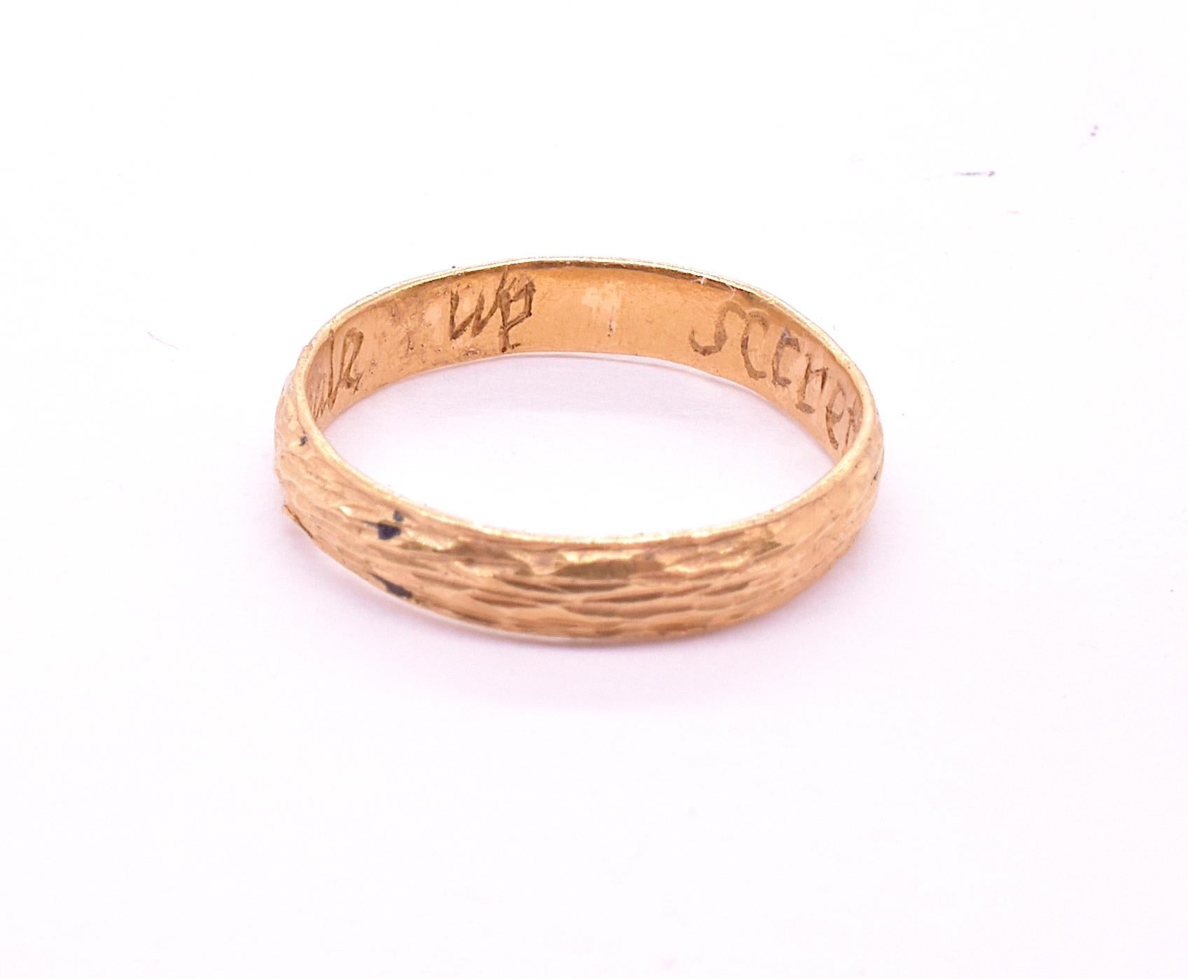 Our poesy ring (spelled posy, posie, or posey) has the deep color of a 22carat ring along with a textured pattern and an interesting inscription 