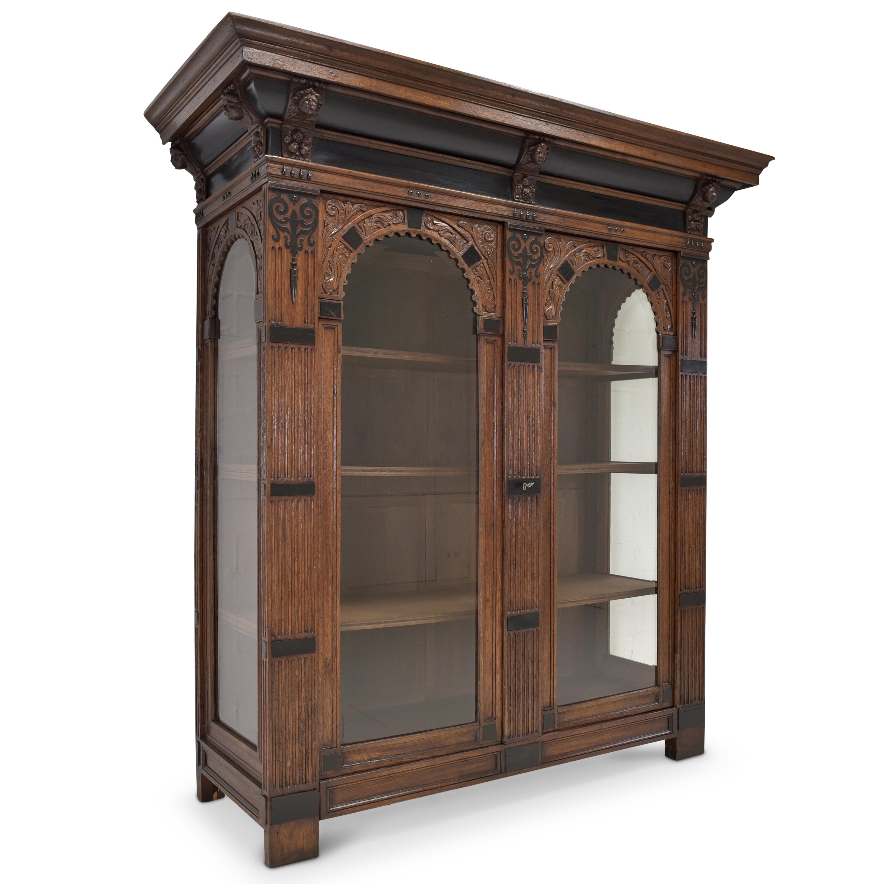 Large Flemish display cabinet restored oak Renaissance Baroque

Features:
Two-door model with 3 shelves, glazed on three sides
High quality
Heavy quality
Ebonized embellishments
Cassette fillings
Facet cut glazing
Height-adjustable