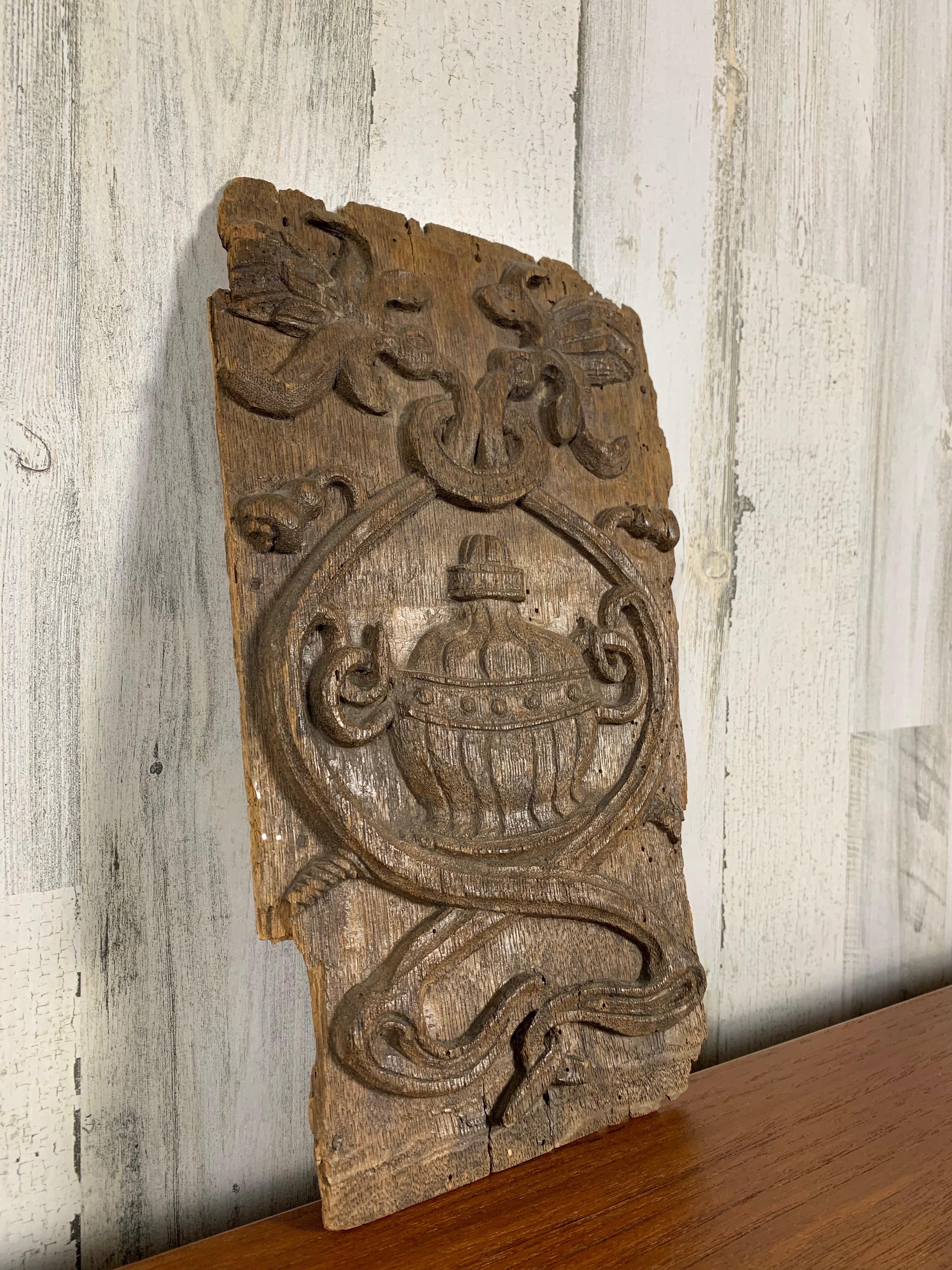 Weathered Renaissance carved oak panel, originally from a piece of furniture.