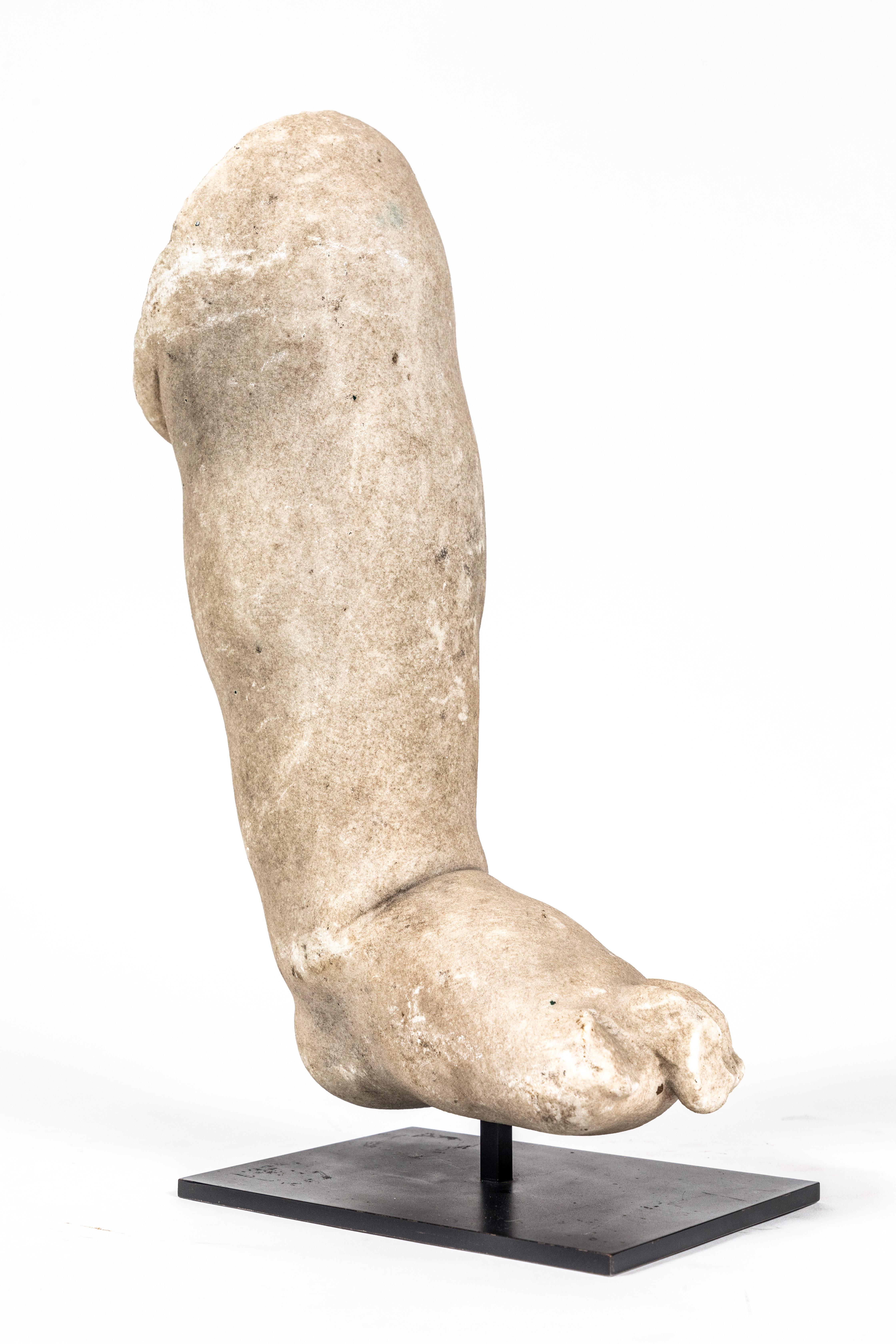 Chic, 15th Century, Roman marble fragment of a left foot and calf mounted on a custom iron stand.