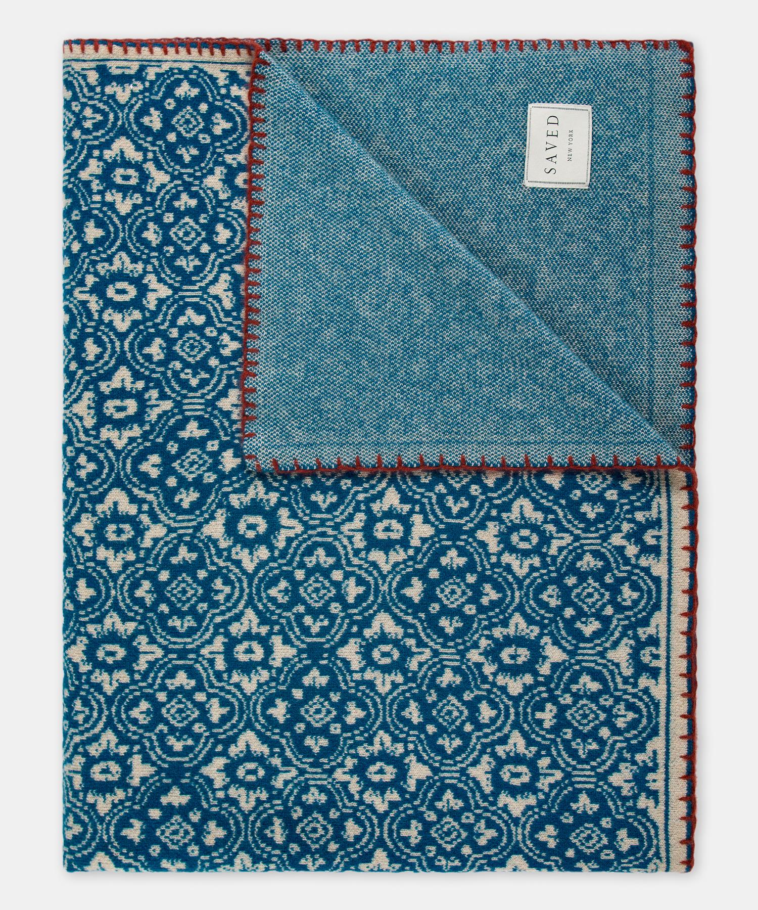 Renaissance N. 25 Bleu Throw by Saved, New York

Antoinette Poisson’s traditional handmade French papers translated into cashmere. Finished by hand with a contrasting rouge blanket stitch and text elements.