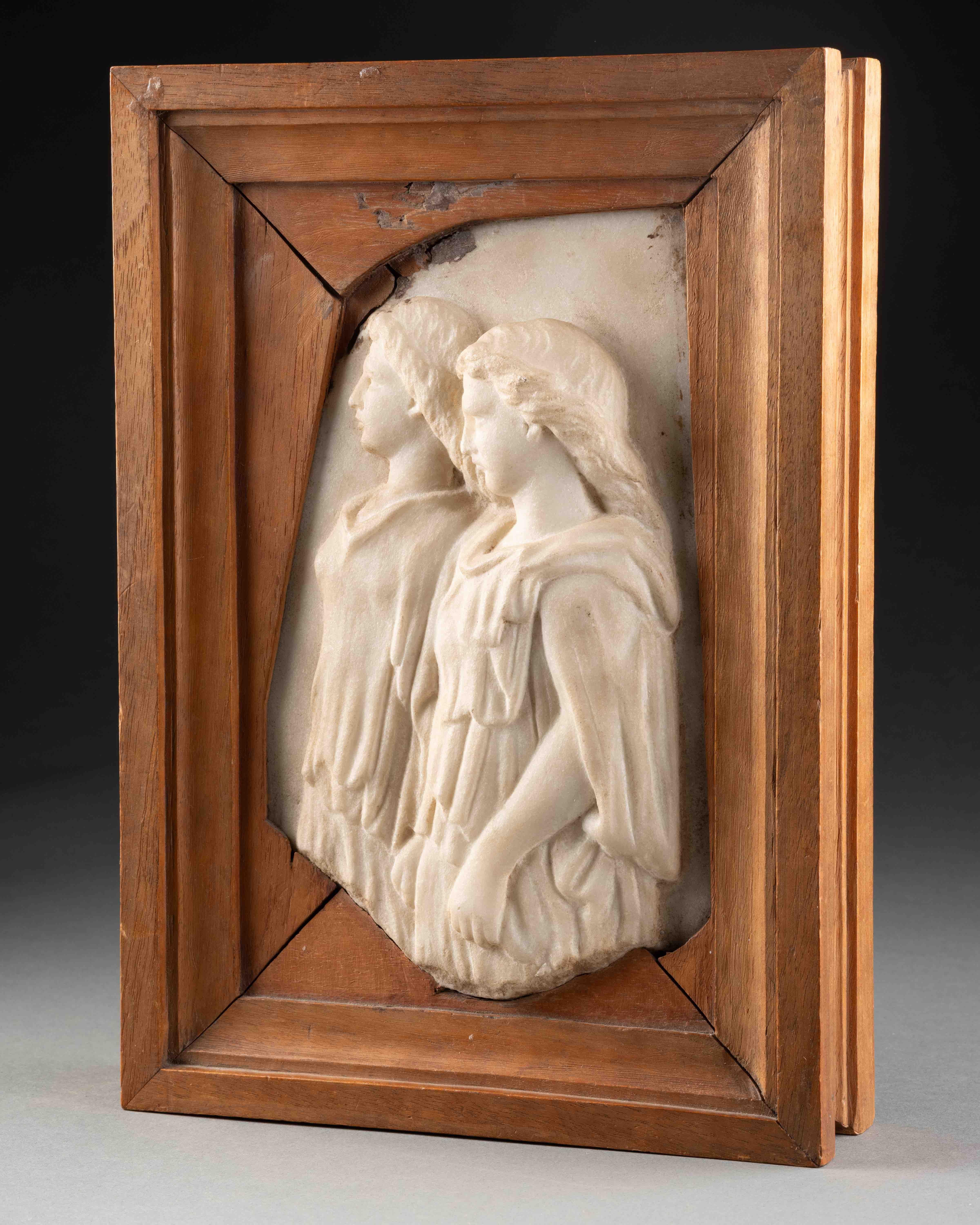 Renaissance relief depicting two female figures dressed in a chiton 
Italy, probably Rome, 16th century 
Marble, wooden frame (provenance label on the back)
28 x 20 x 5 cm

This beautiful Renaissance fragment depicts two female figures in profile,