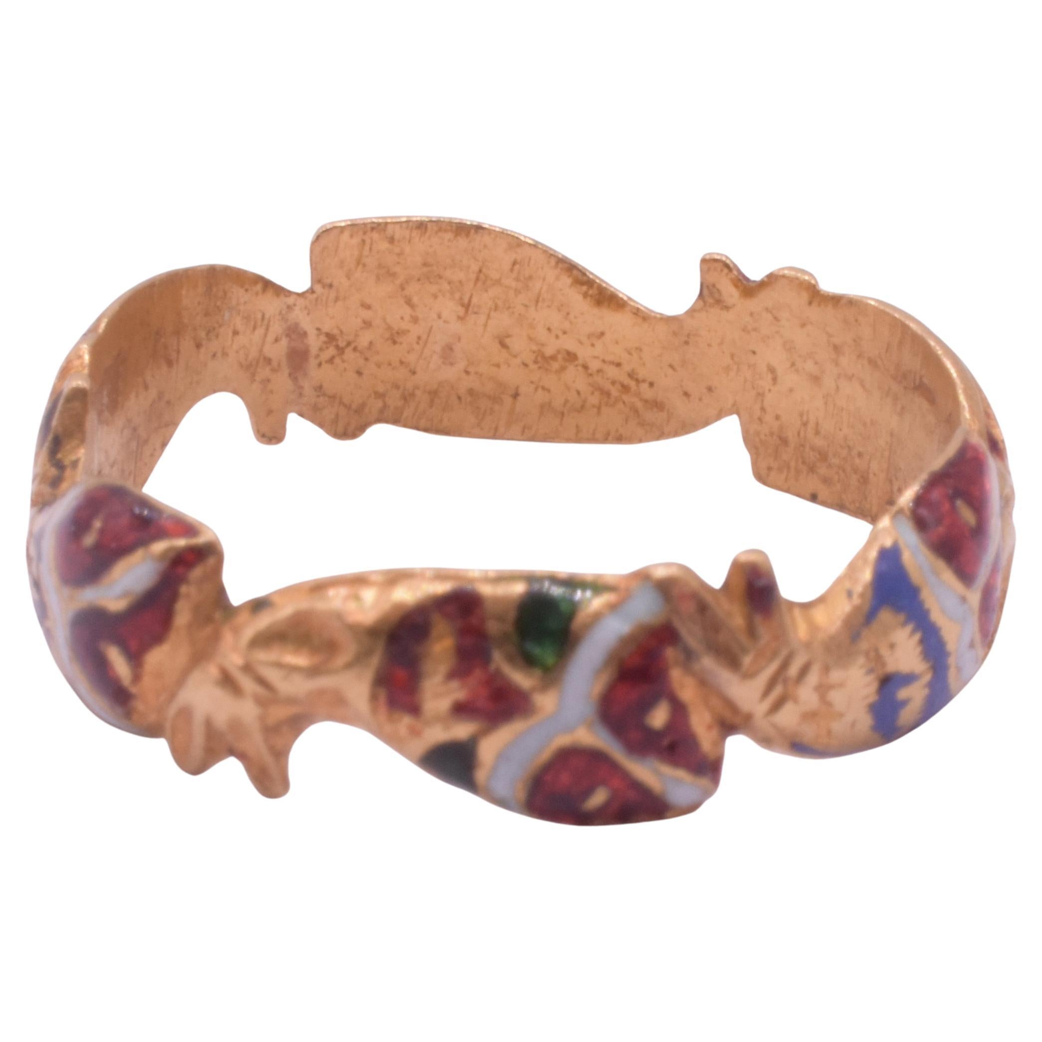 Our Renaissance era religious devotional ring has its original shank of rich high carat gold with bright enamel colors  in the form of circling fish. The fish is symbolic for both Christianity and Judaism.

The ichthys, often seen carved on Roman