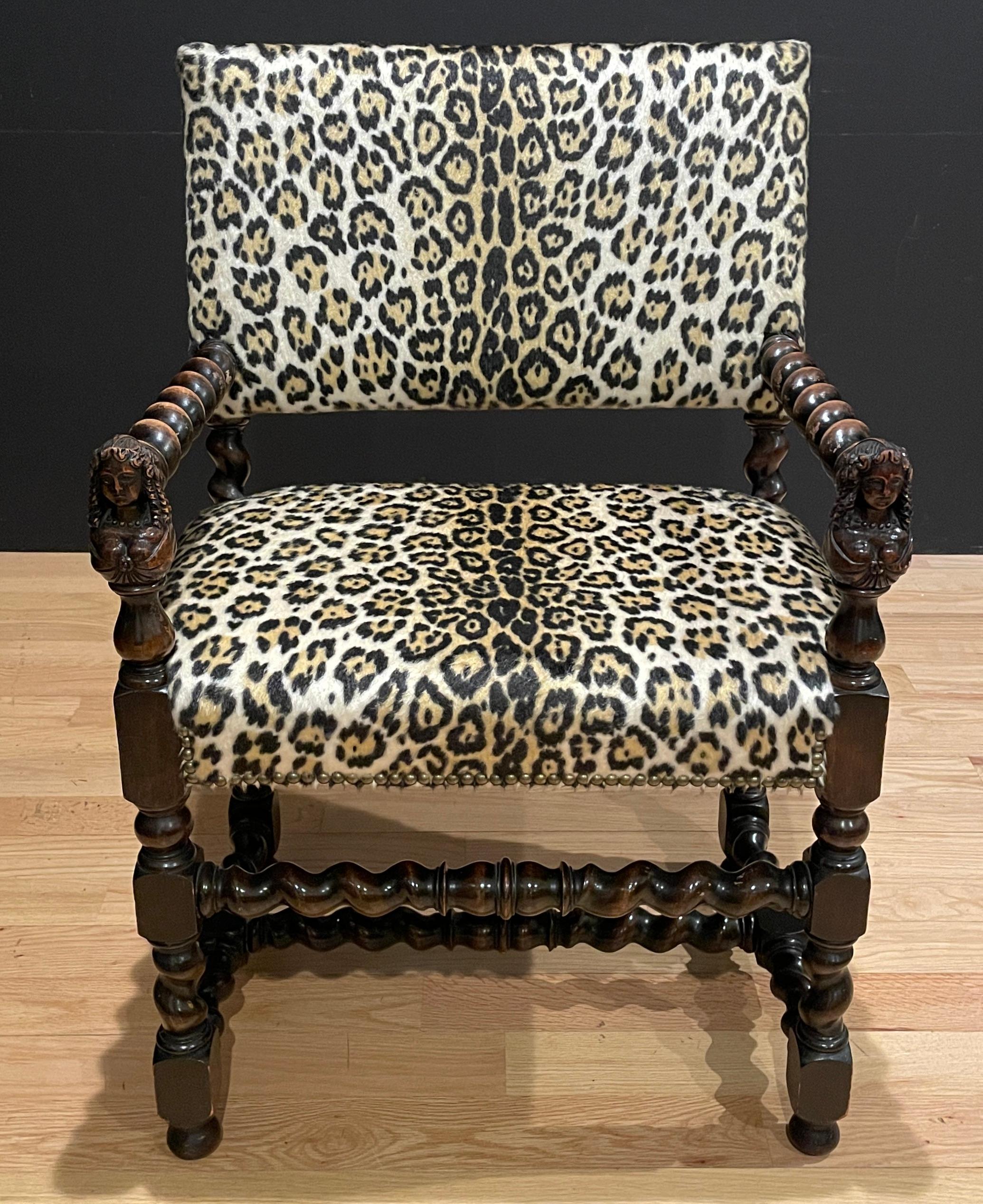 Leopard print William and Mary style carved walnut armchair. Twisted arms and stretchers. Arm ends with carved female busts. Continental circa 1900.