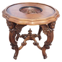 Mesa auxiliar de madera de frutal tallada renacentista