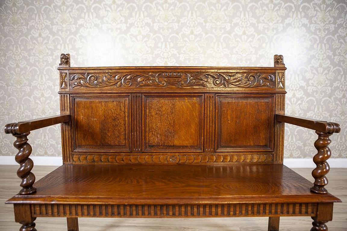 Renaissance revival carved Oak bench, circa 1880

We present you this bench in the Neo-Renaissance style, with spirally turned front legs and arm supports.
The backrest is divided by three square panels.
Furthermore, the top rail of the backrest